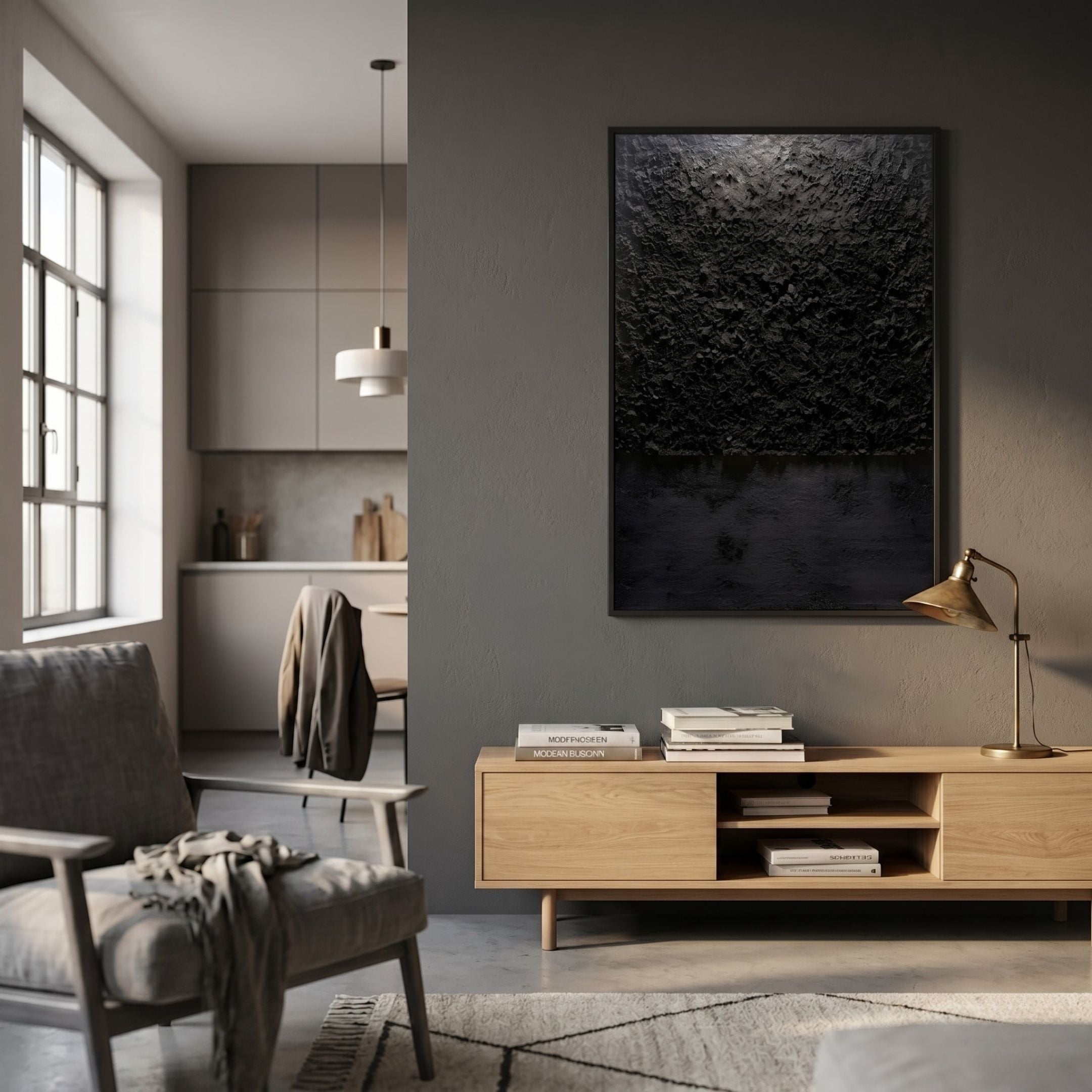 Aeralune Midnight Black Textured Oil Painting 3D Wall Art by Giant Sculptures hung on a grey wall above an oak console with books and a brass lamp.