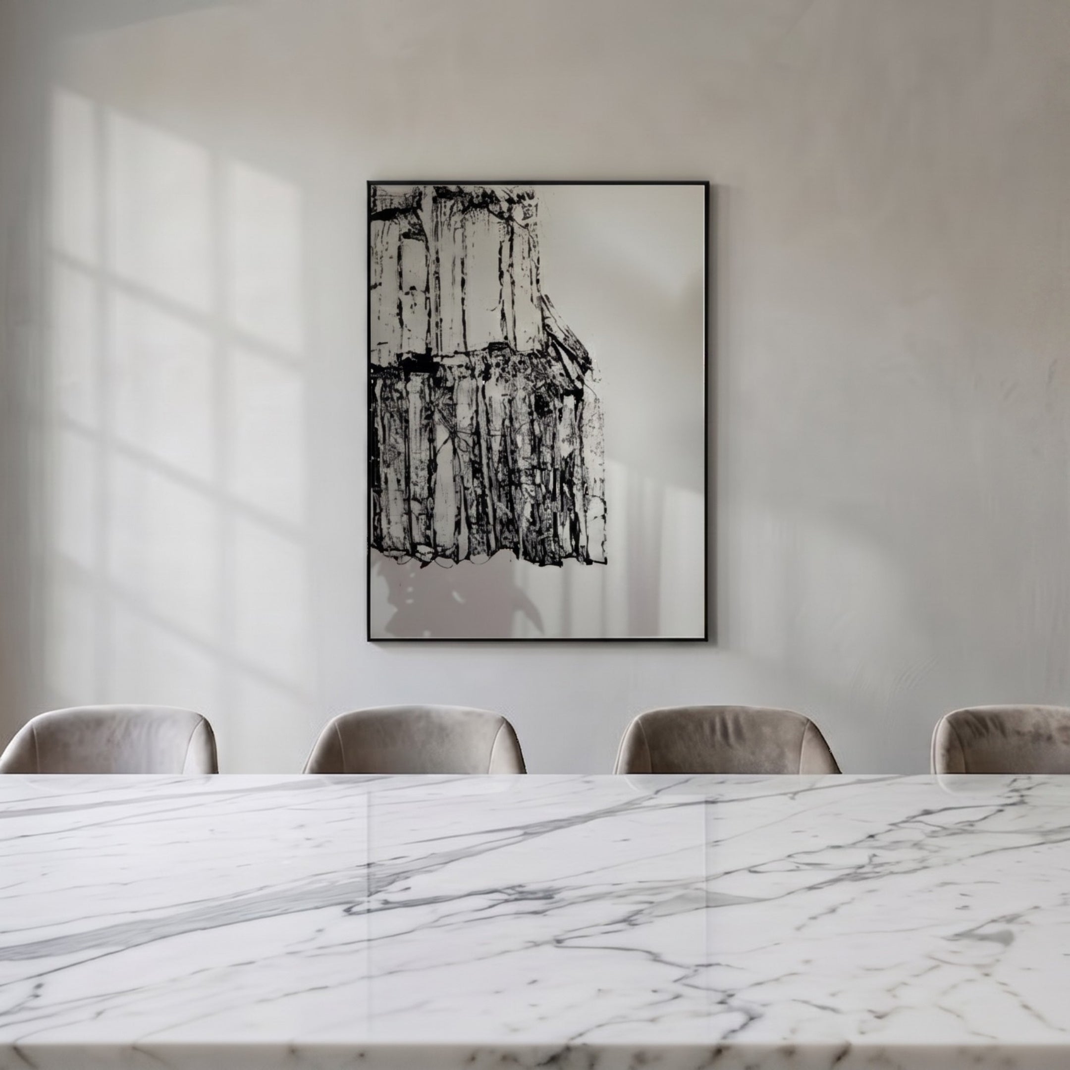 Rivarenne Black Abstract Texture Steel Mirror 3D Wall Art by Giant Sculptures displayed in a dining room above a marble table with velvet chairs, showing black relief texture on a reflective steel mirror in a black frame.