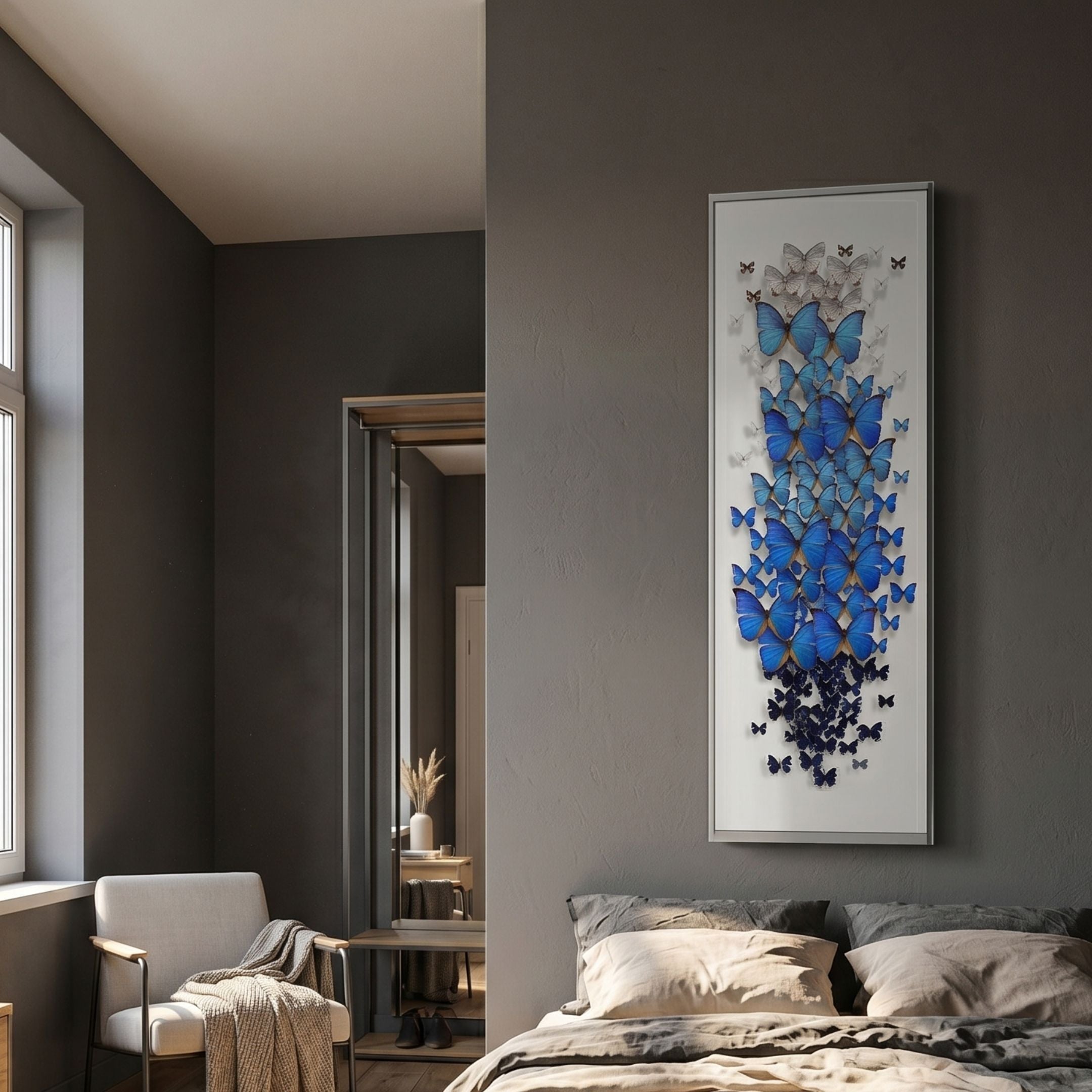 Papillora Blue Gradient Butterfly Acrylic 3D Wall Art by Giant Sculptures, a tall slim framed cascade of white-to-navy butterflies on a grey bedroom wall.