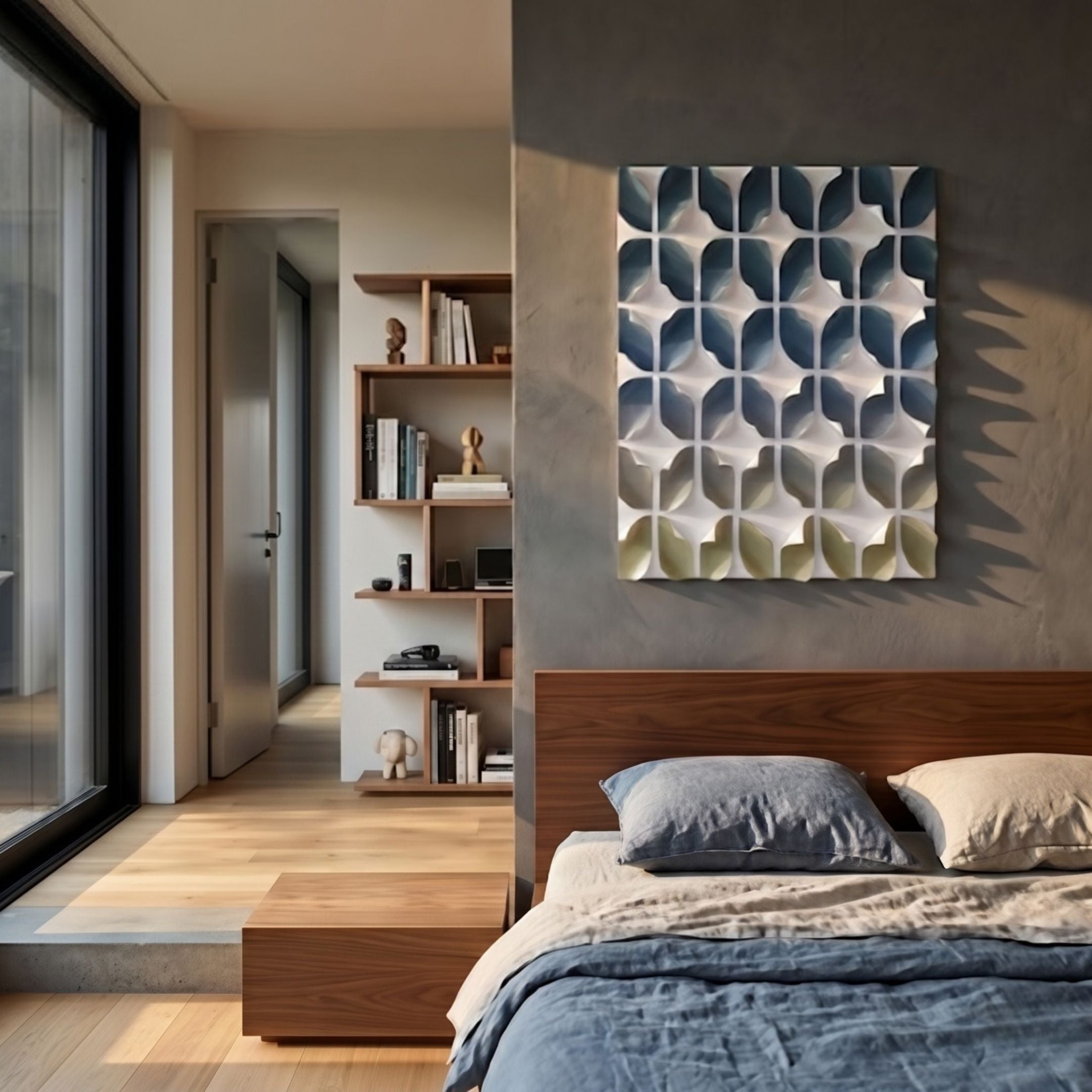 Foliora Navy & Sand Grid Leaf Acrylic 3D Wall Art by Giant Sculptures mounted on a grey bedroom wall above a walnut bed, beside a wooden bookshelf.