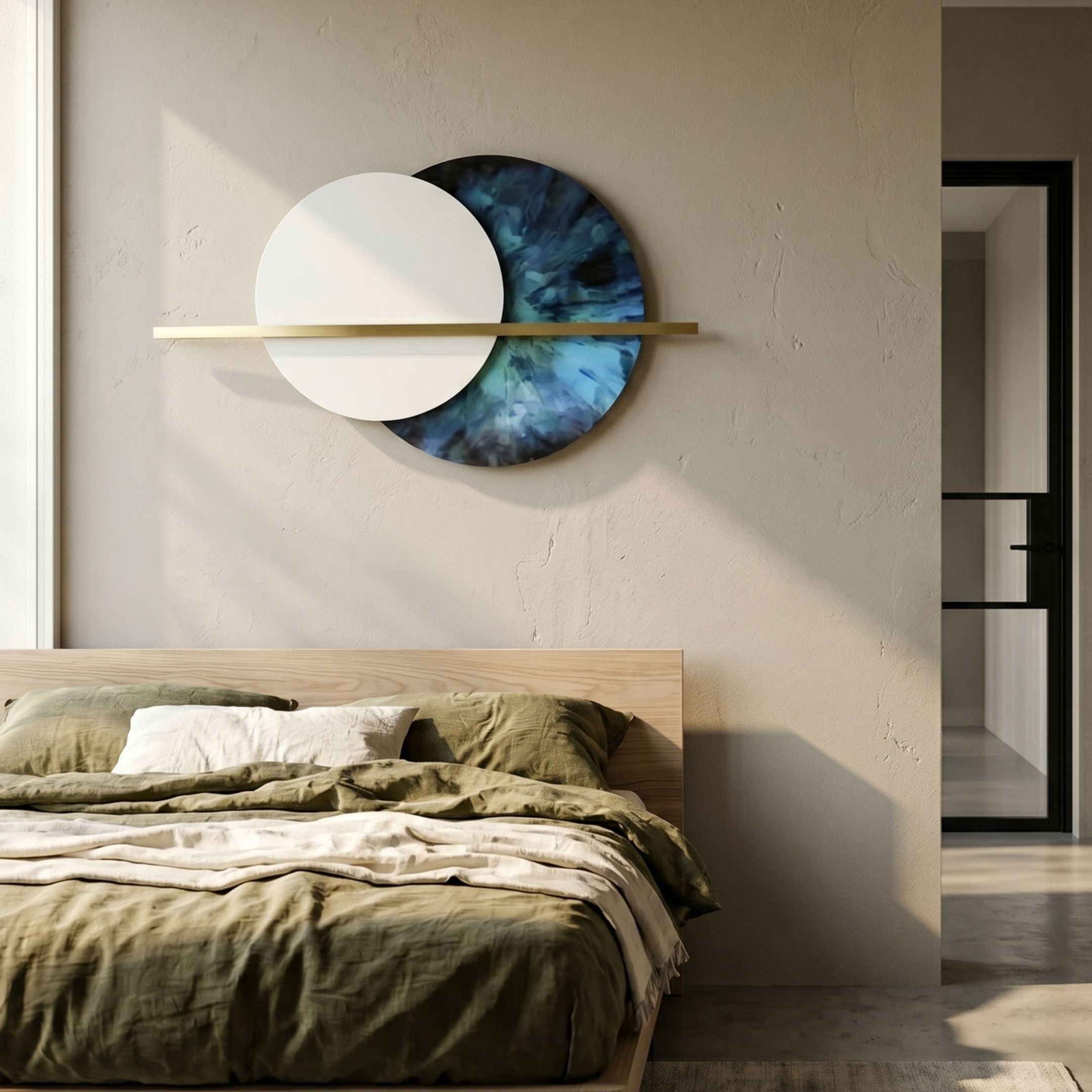 Caldris Sapphire II Crystal Porcelain & Gold Strip 3D Wall Art with overlapping white and sapphire blue discs crossed by a gold strip, mounted above a bed.