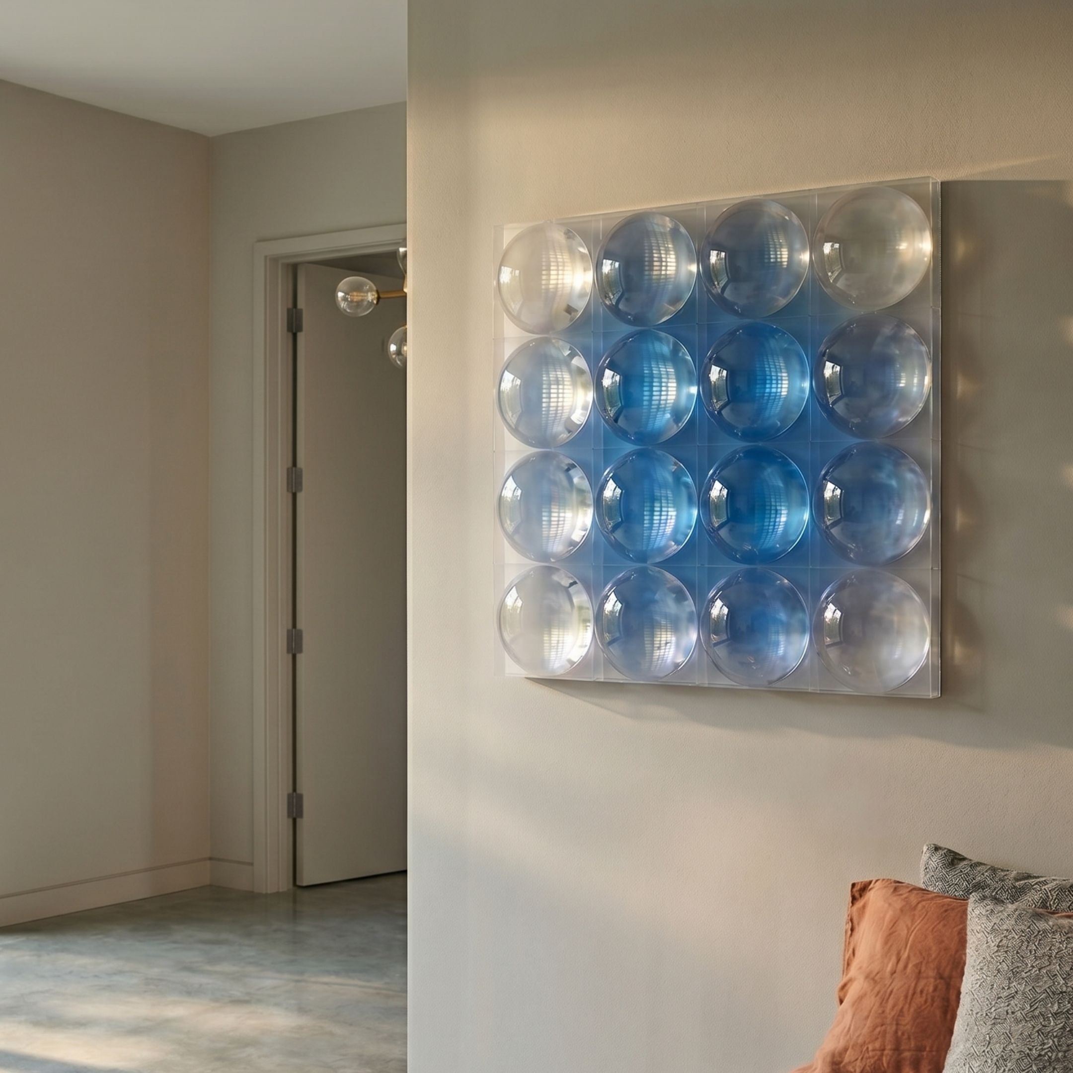 Dromara Sky Blue Fade Acrylic Square 3D Wall Art by Giant Sculptures displayed in a neutral hallway, its sixteen clear domes glowing over a blue-to-white gradient.