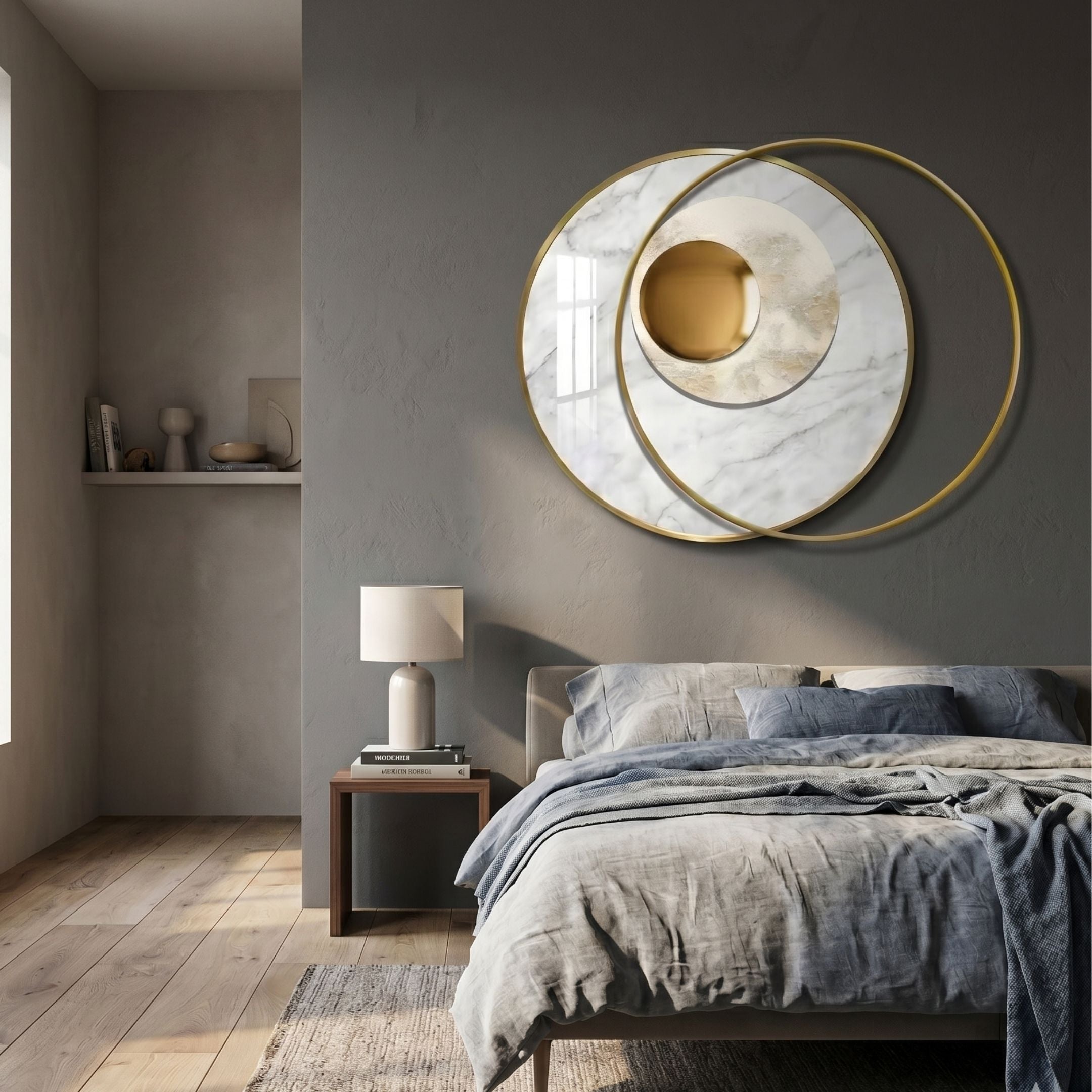 Solvata White Marble Orbit & Metal Ring 3D Wall Art by Giant Sculptures mounted above a bed with blue linen, beside a walnut nightstand and lamp.