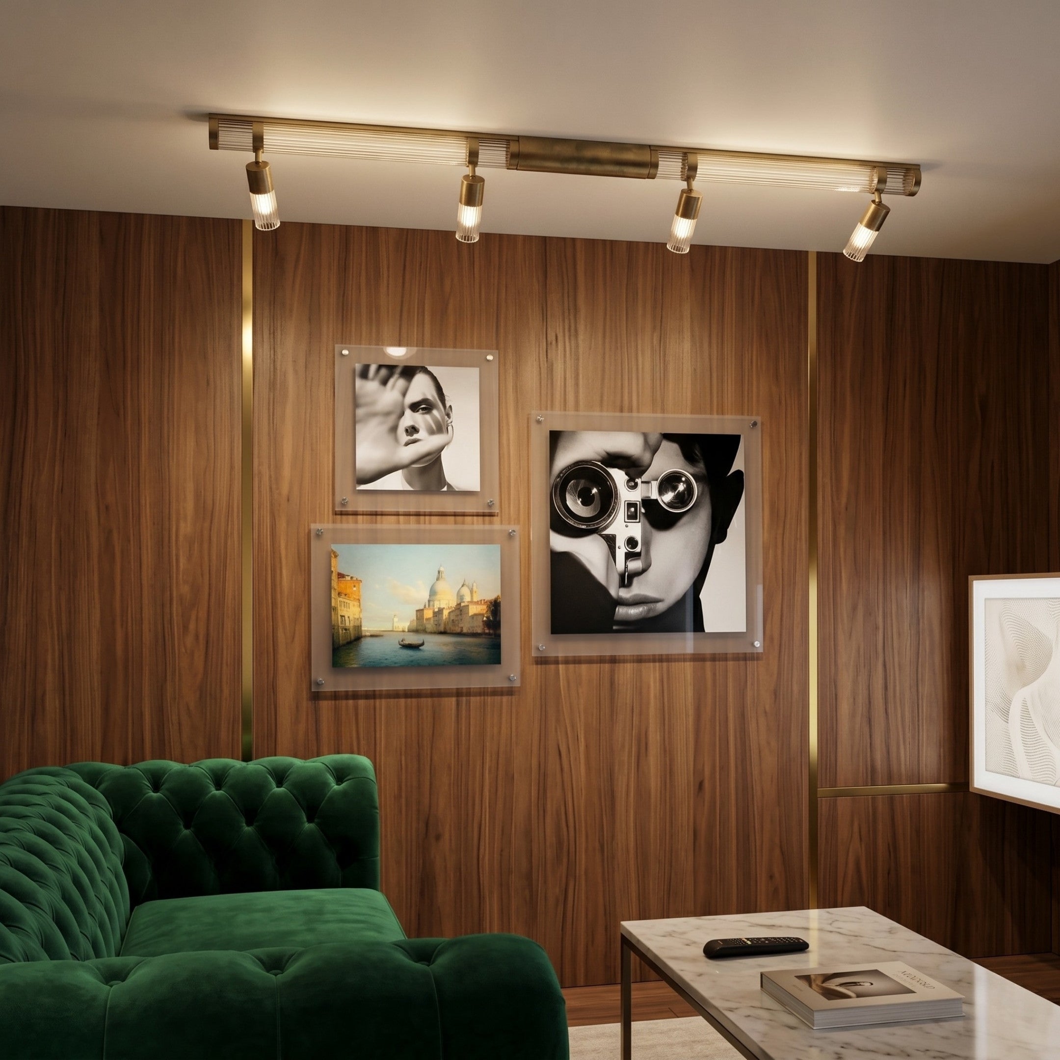 A modern living room with wood-paneled walls, a green velvet sofa, marble coffee table, and Giant Sculptures’ CineLuxe Venice Glow Landscape 3-Panel Acrylic Wall Art creates striking modern decor under a brass track light.