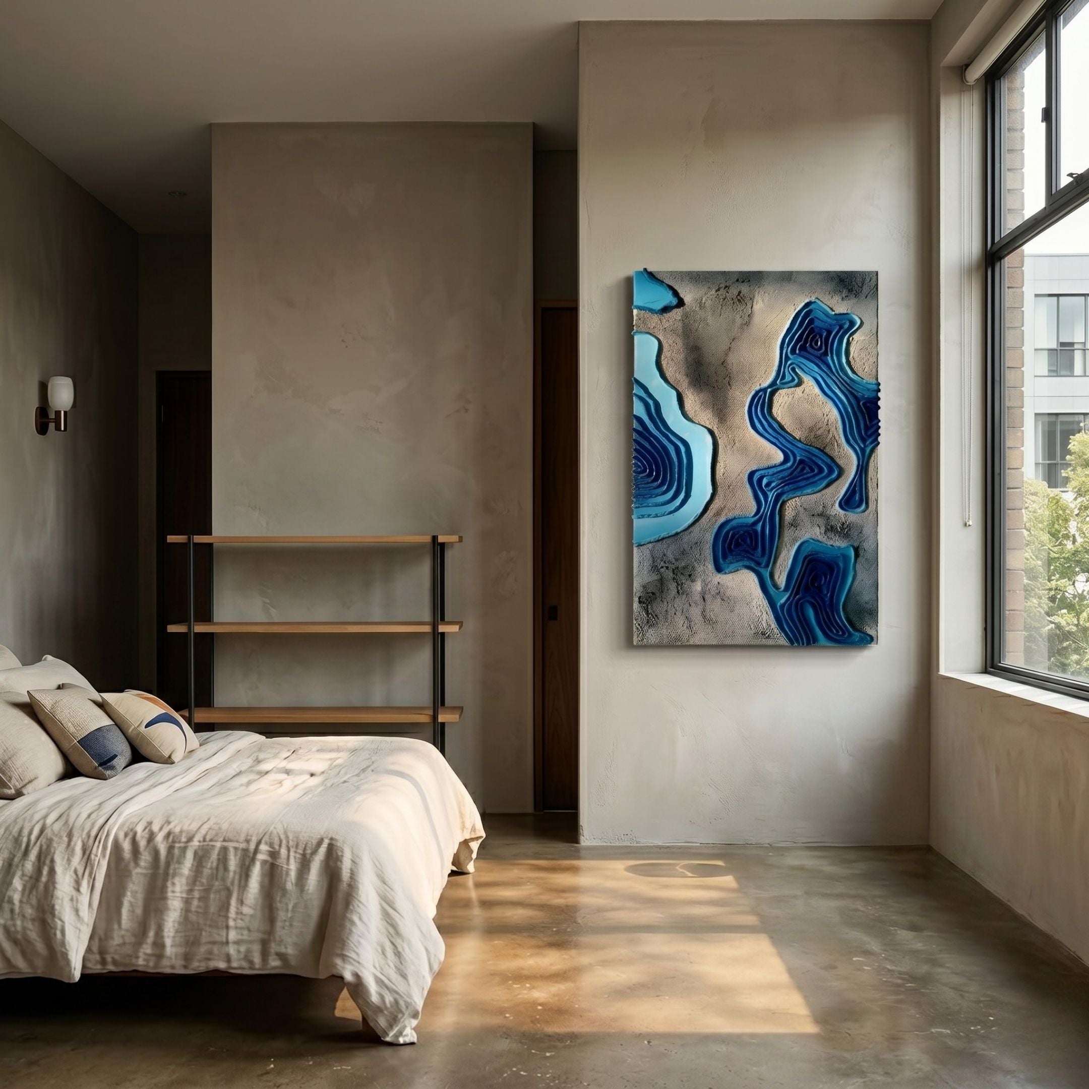 Terracore Aqua Blue Contour Relief Abstract 3D Wall Art mounted on a beige plaster wall in a modern bedroom with linen bed, shelving, and large window.
