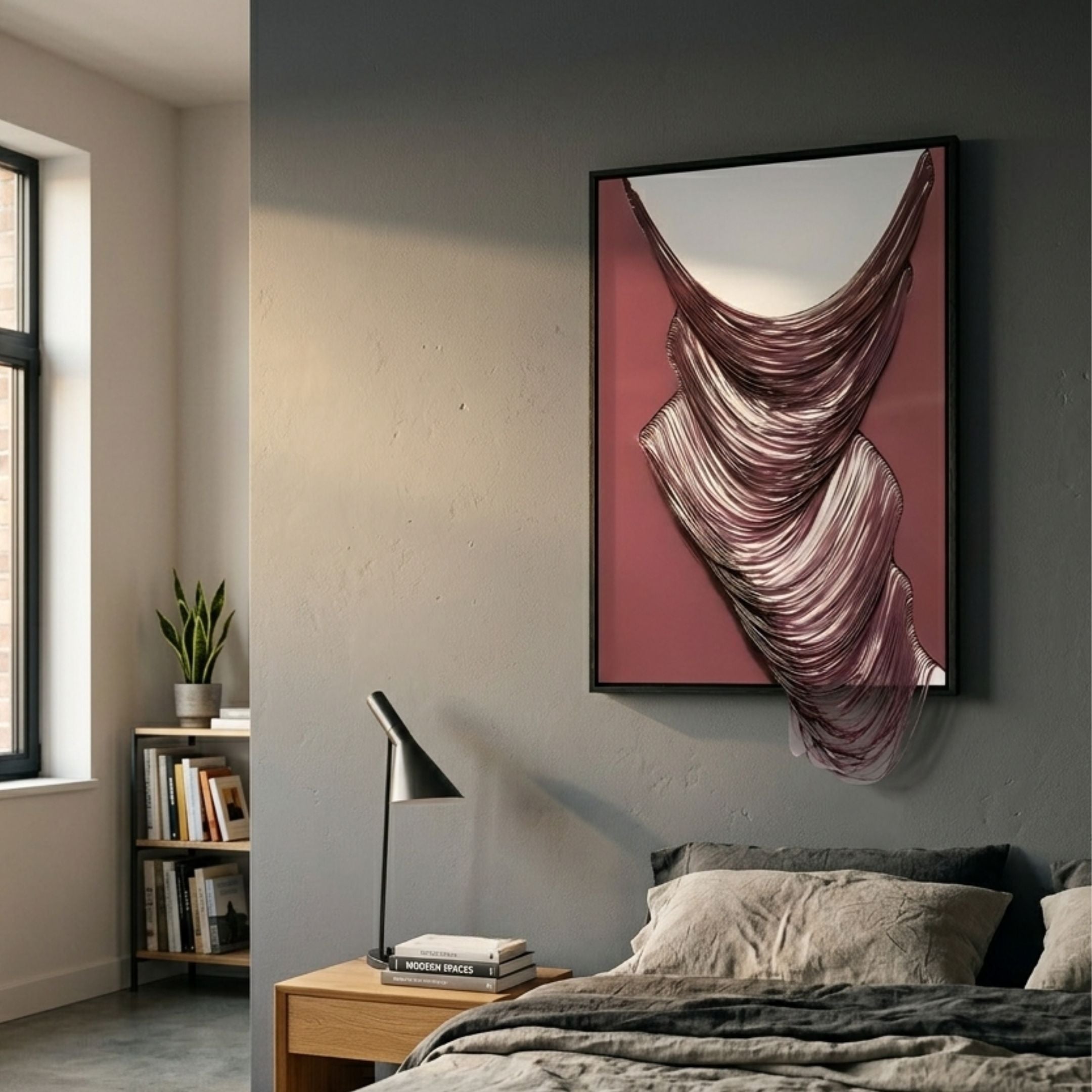 Arvinea Rose Flow Sculptural Leather 3D Wall Art with cascading rose and blush ribbons on a deep rose panel, displayed above a bed in a grey-walled bedroom.