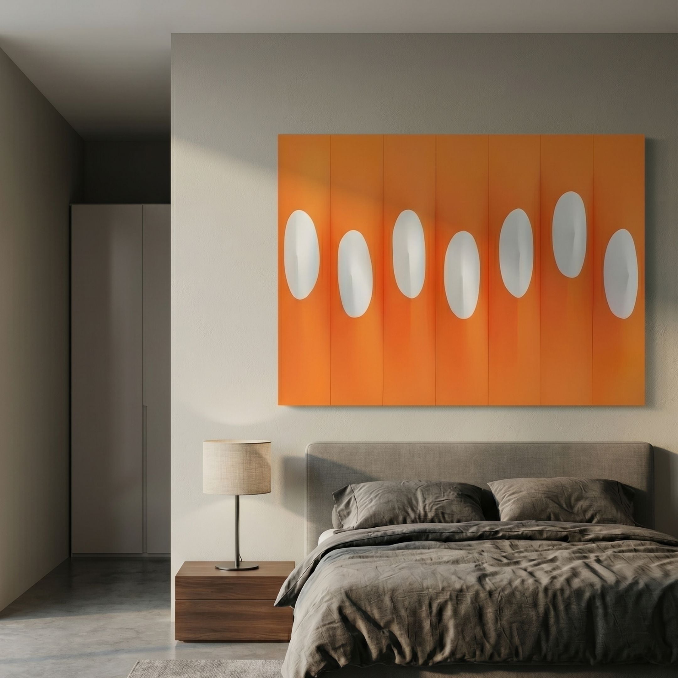 Virello Flame Orange & White Disc Leather 3D Wall Art by Giant Sculptures mounted above a grey upholstered bed with walnut nightstand and lamp in a modern bedroom.