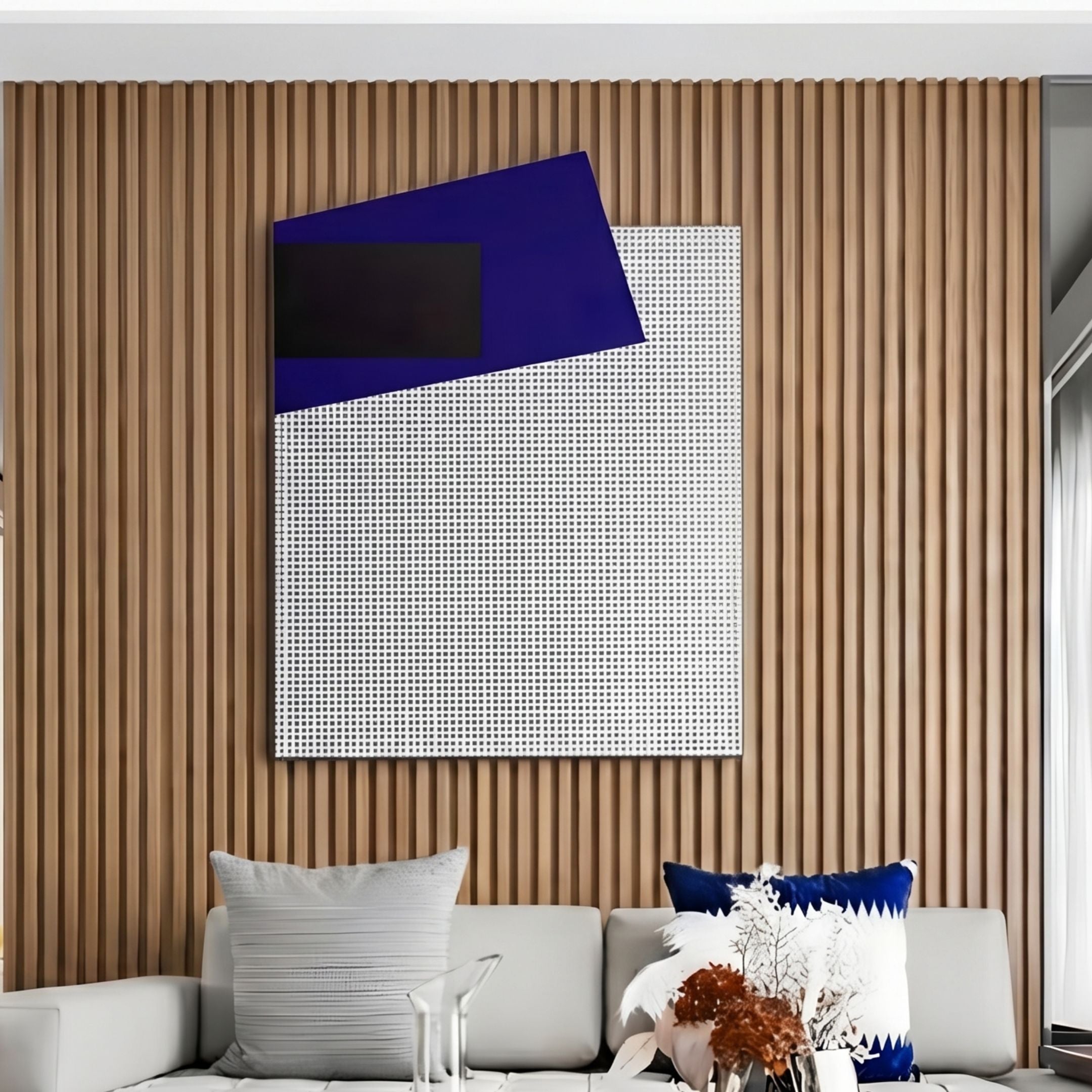 Gridorra Black & Navy Leather Grid Panel 3D Wall Art displayed on a slatted wood wall above a white sofa with navy and white cushions.