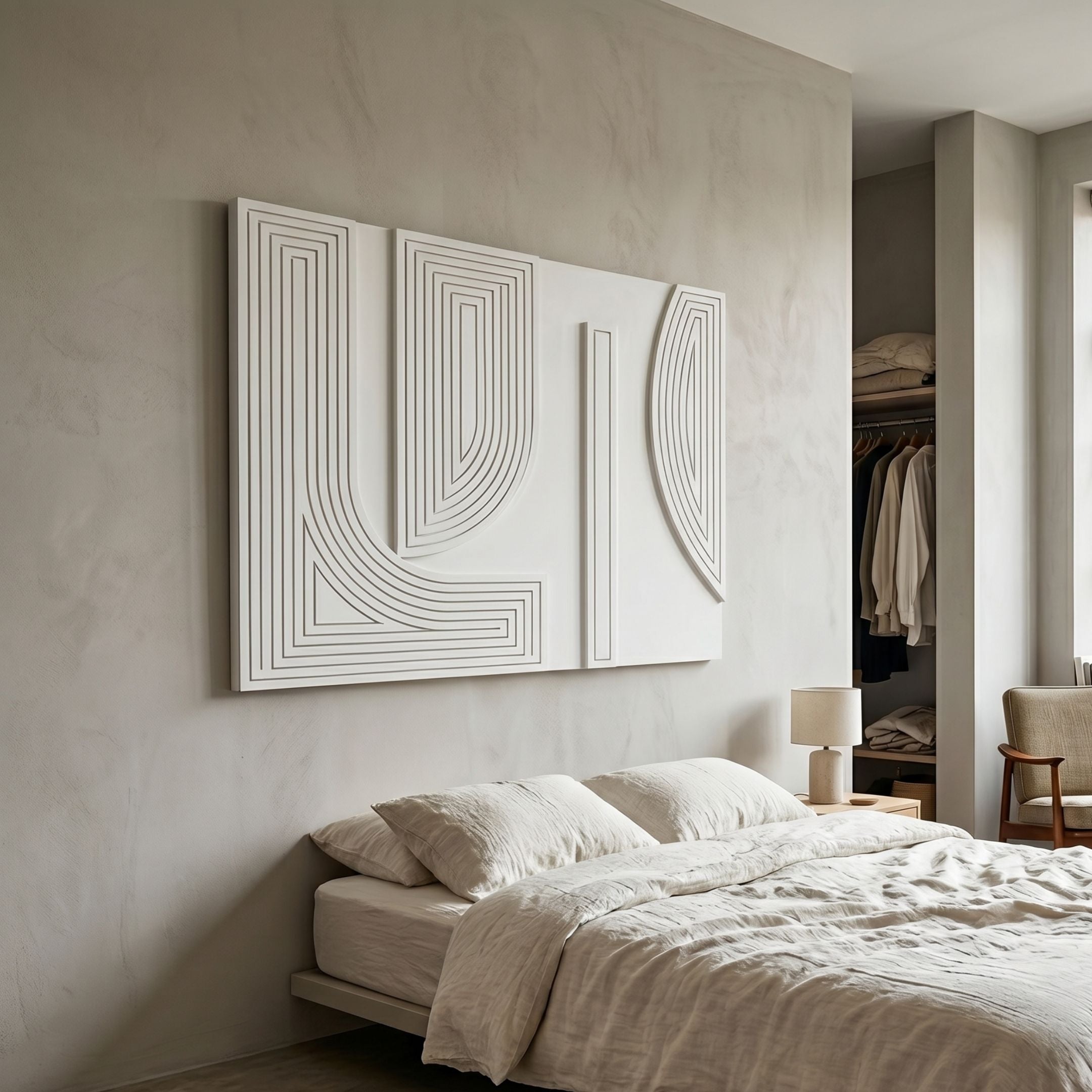 Lineaform Dual Curve Wood Carving 3D Wall Art by Giant Sculptures mounted above a linen-dressed bed in a neutral bedroom with an open wardrobe nearby.