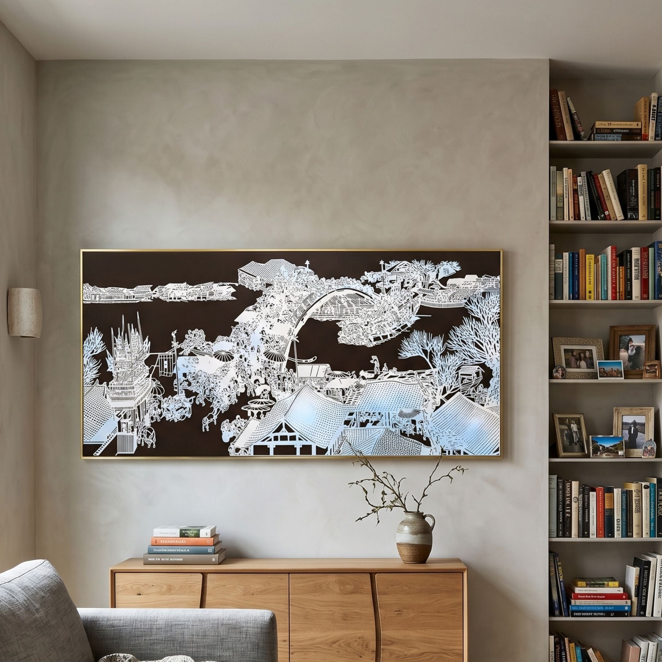 Kasora Noir Village 3D Carving Wall Art by Giant Sculptures, white paper-cut village on black, mounted above an oak sideboard beside a tall bookshelf.