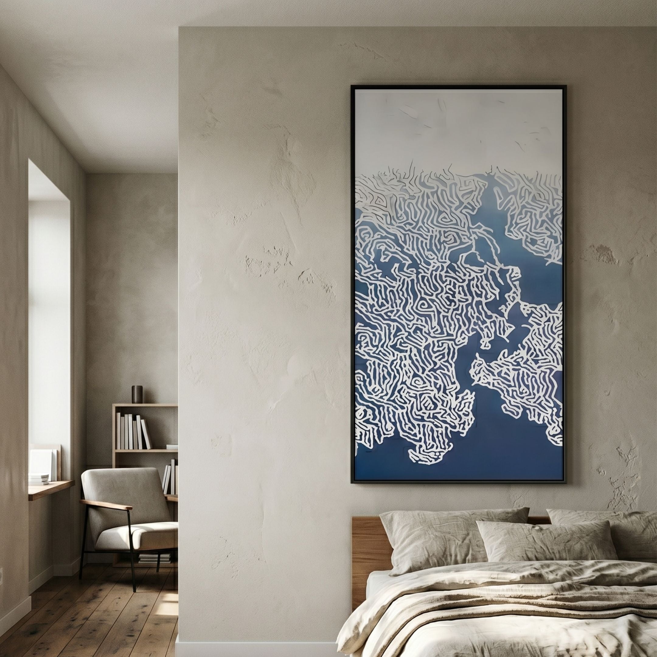 Navara Blue Tides 3D Carving Wall Art with white maze-like topographic relief on a deep blue gradient, black-framed and mounted in a bedroom above the bed.