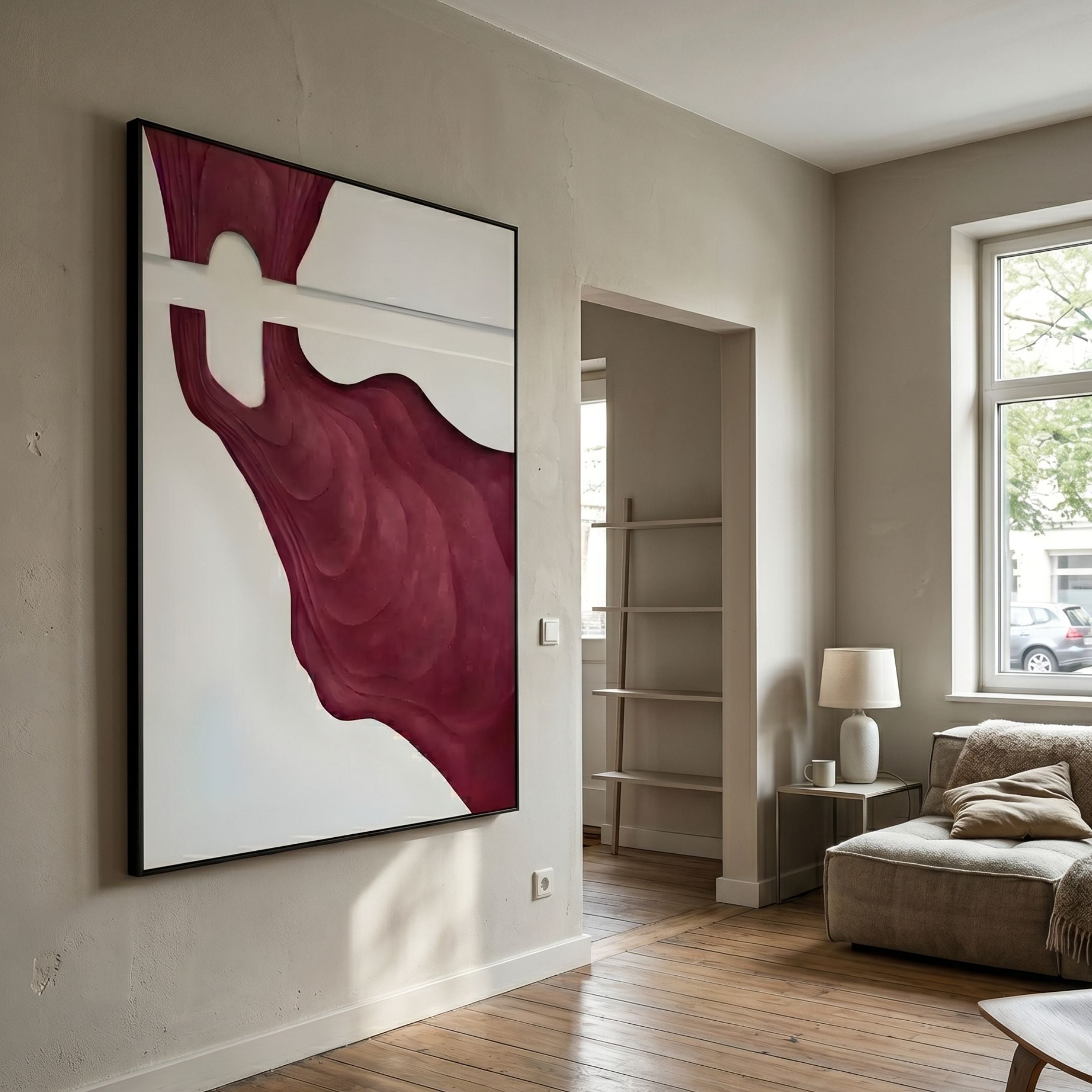 Fluvien Deep Red Flow 3D Carving Wall Art by Giant Sculptures displayed in a neutral living room with wooden floor, beige sofa, and window light.