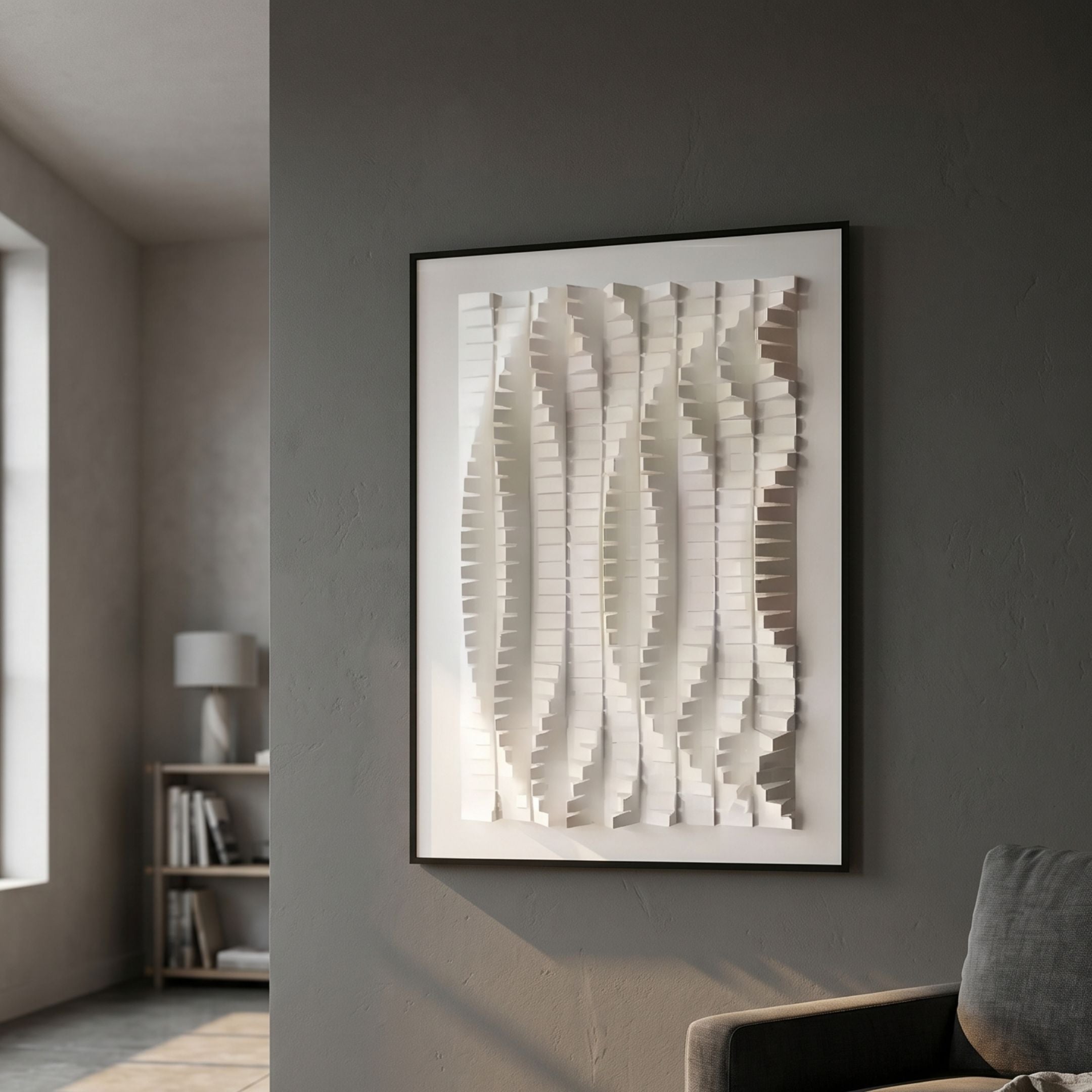 Velistra Harmonic Flow 3D Relief Wall Art by Giant Sculptures, white vertical ridged relief in a black frame, mounted on a grey living room wall.