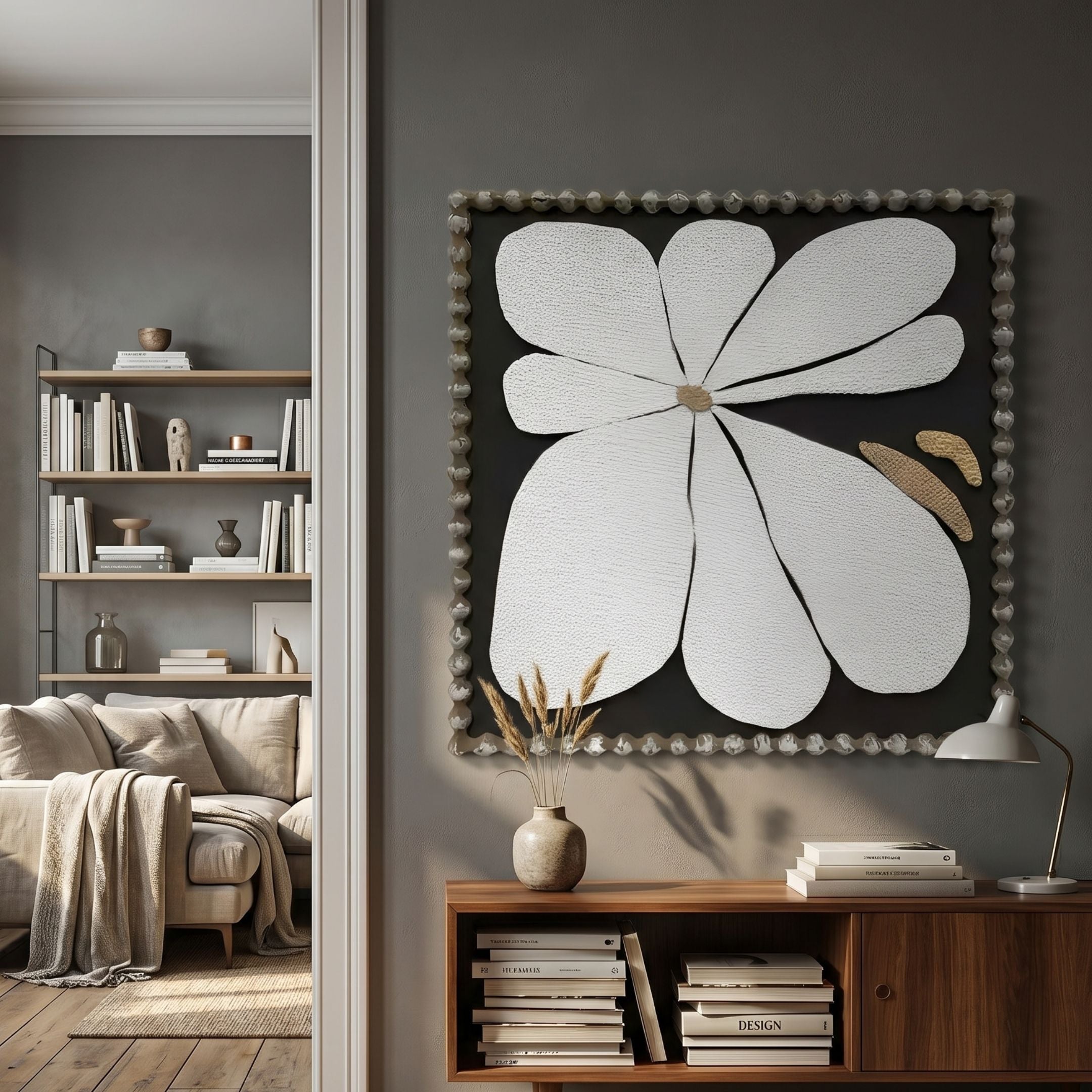 Petala Black & White Bloom Wood Relief 3D Wall Art by Giant Sculptures displayed on a grey living room wall above a walnut console with books and a vase.