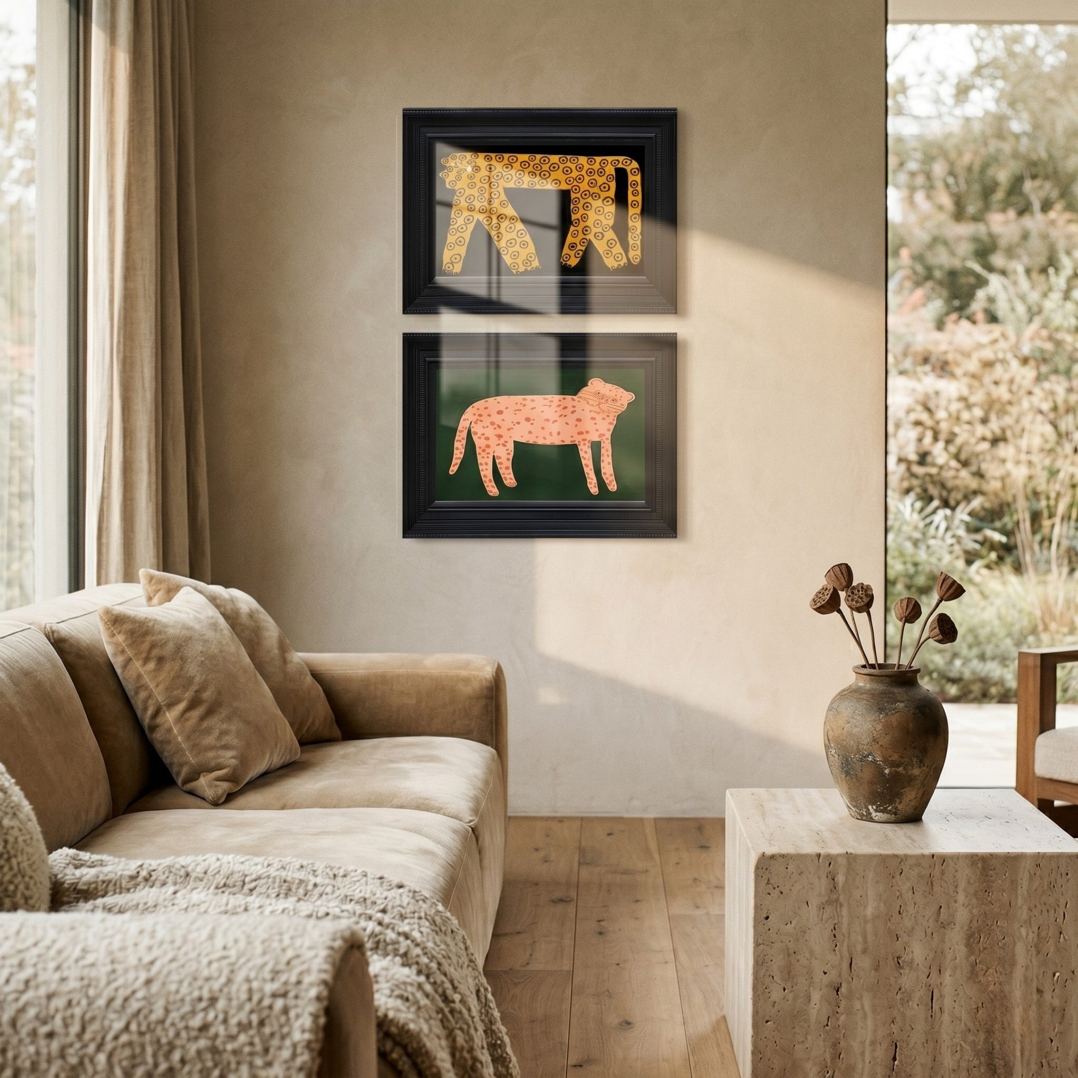 Ardensir Golden Leopard Duo 2-Set Framed Wall Art by Giant Sculptures displayed in a neutral living room, showing a golden spotted leopard on black and a blush leopard on green, both in black ornate frames above a tan sofa.