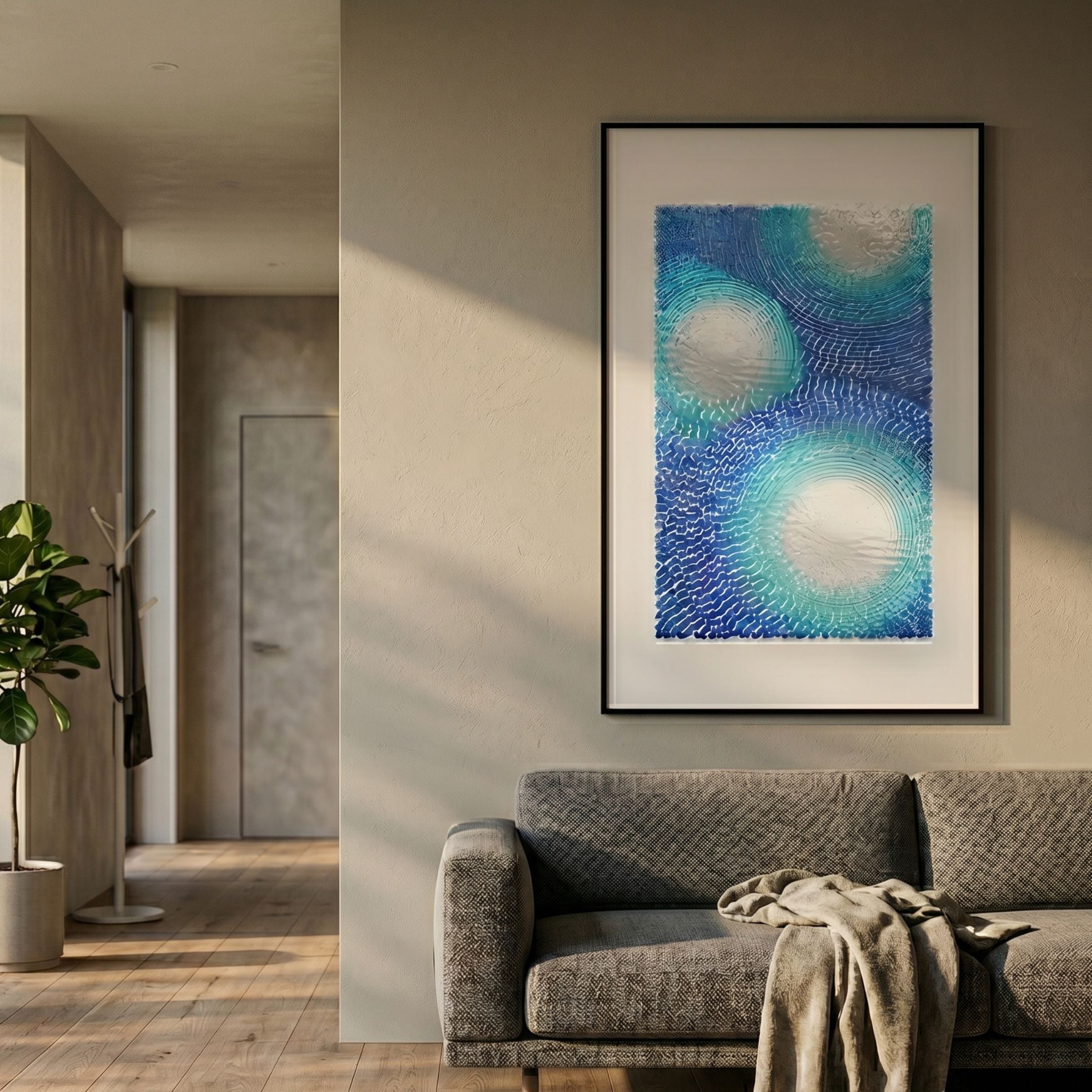 Glaciera Turquoise Sky Silver Acrylic 3D Wall Art by Giant Sculptures, framed above a grey sofa in a modern living room with wood floors and a fiddle-leaf plant.