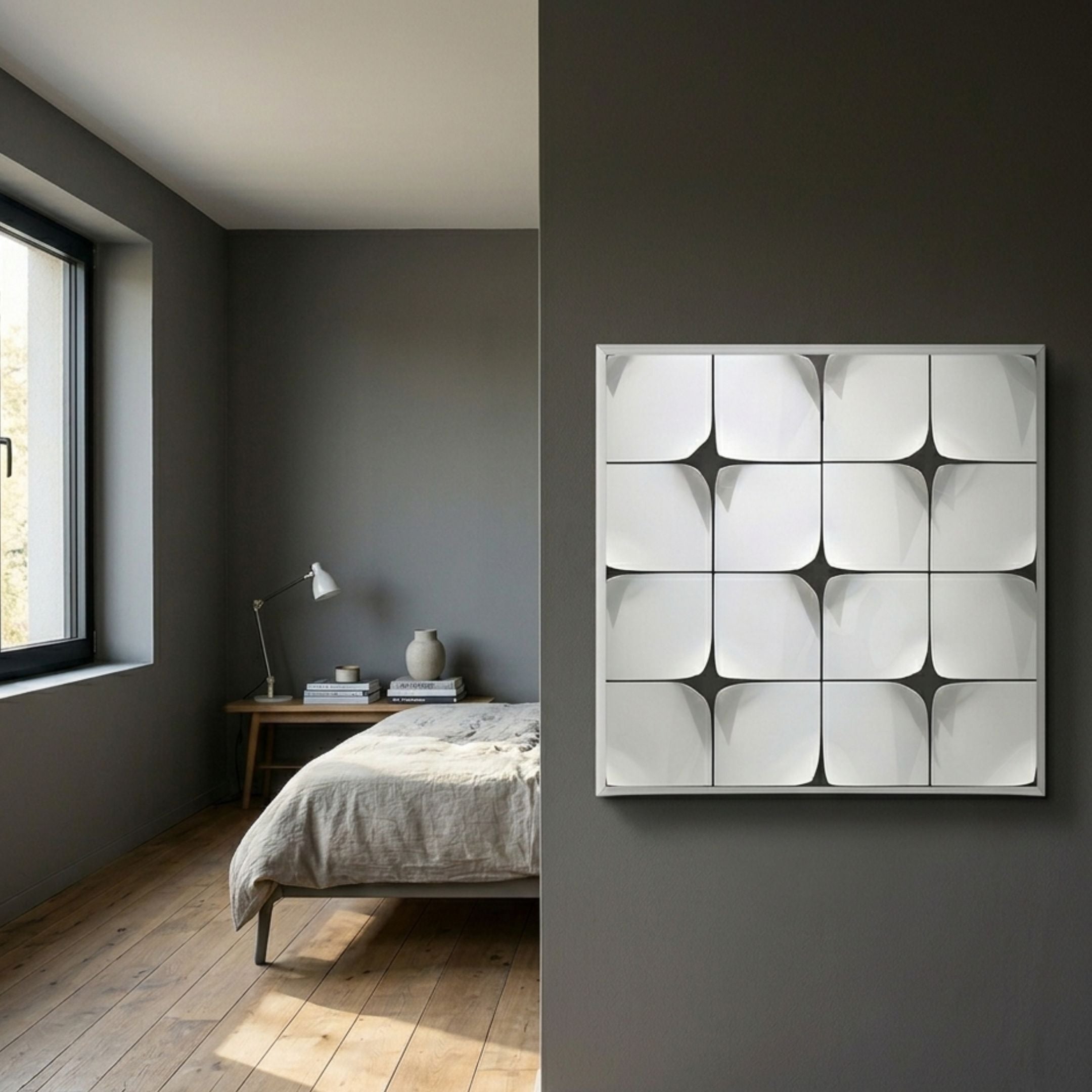 Glint Glossy White Curved Grid Framed Acrylic 3D Wall Art by Giant Sculptures displayed on a dark grey wall in a minimalist bedroom with oak flooring.