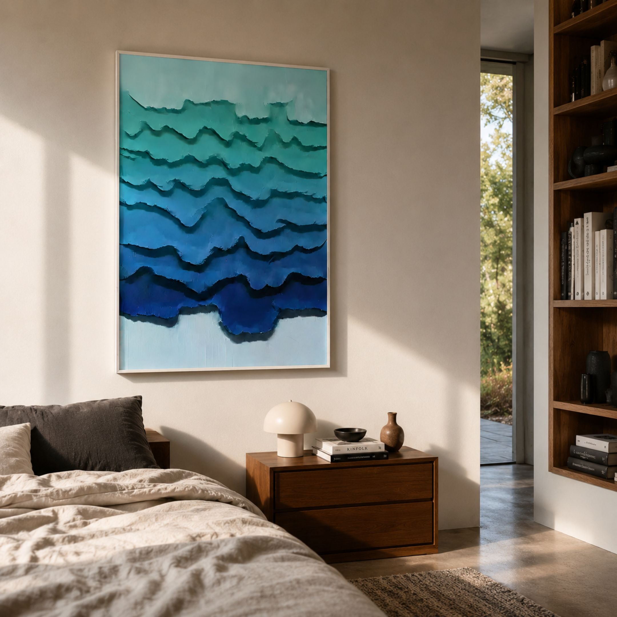 Cascade Deep Teal Crest Paper 3D Wall Art by Giant Sculptures displayed above a walnut nightstand in a sunlit bedroom with linen bedding and a built-in bookshelf.