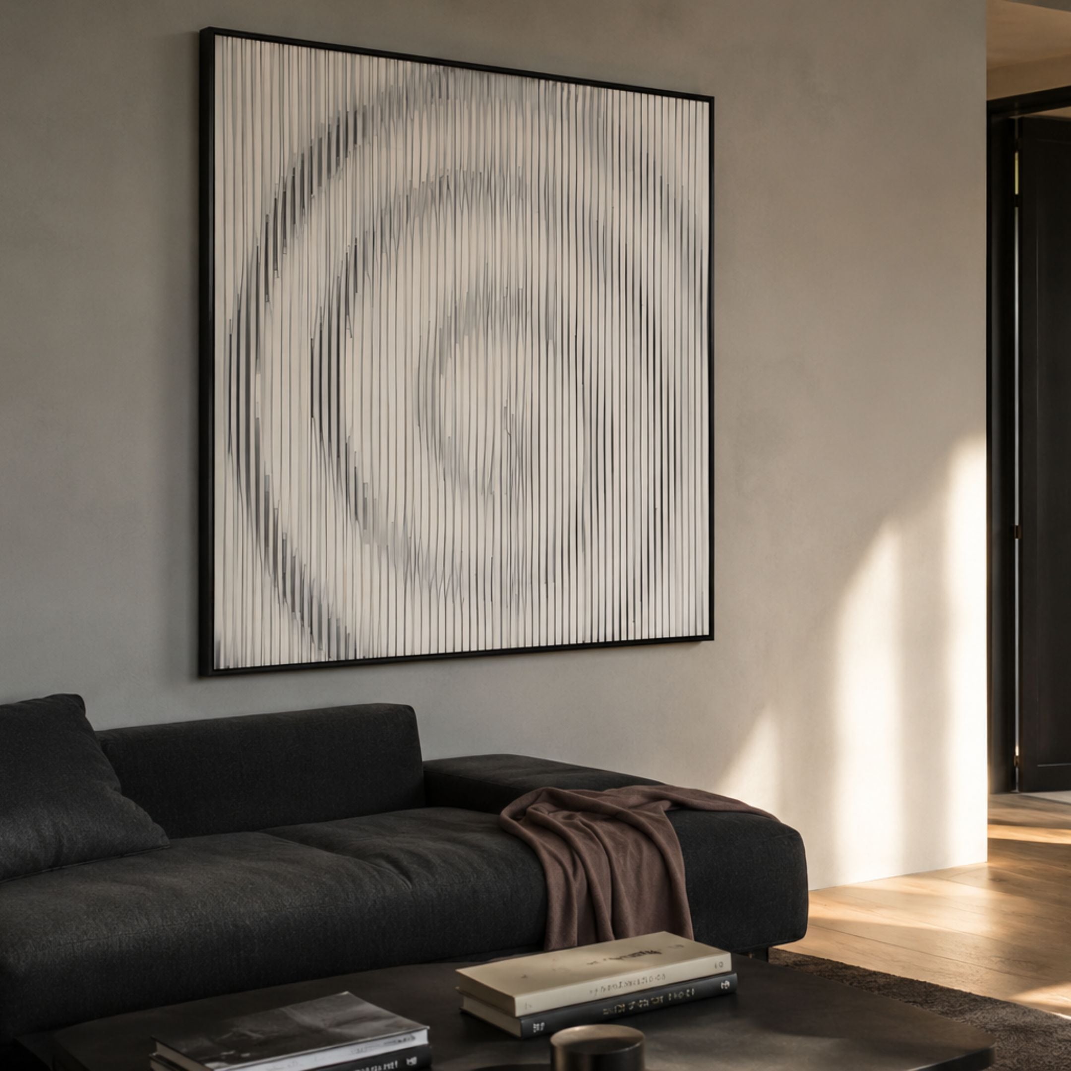Luna III Spiral Illusion Flow Acrylic 3D Wall Art by Giant Sculptures, white vertical slats forming a spiral vortex in a black frame above a charcoal sofa.
