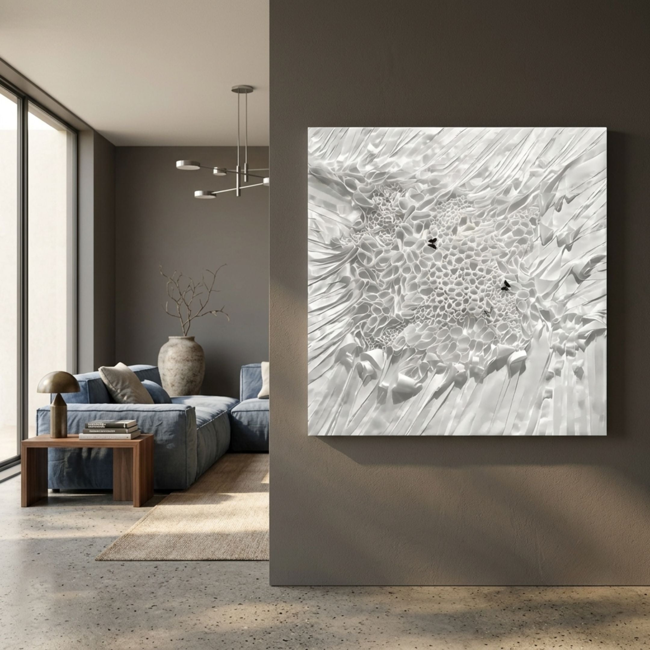 Velorra Pearl White Bloom Ribbon Frameless 3D Wall Art by Giant Sculptures mounted on a grey wall beside a modern living room with blue sofa and vase.