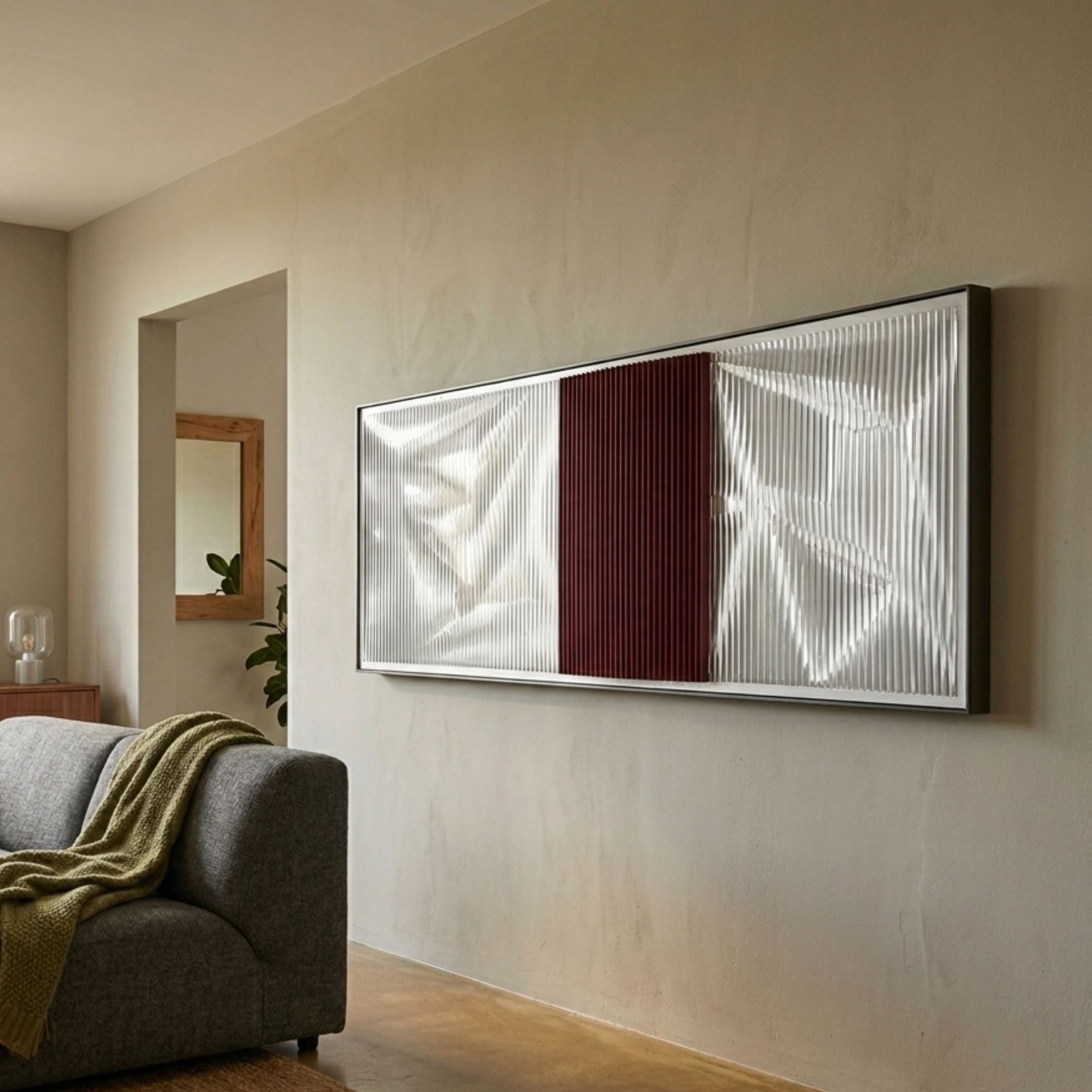Vistara VII Crimson & White Crinkle Texture Acrylic 3D Wall Art by Giant Sculptures mounted above a grey sofa in a warm neutral living room.