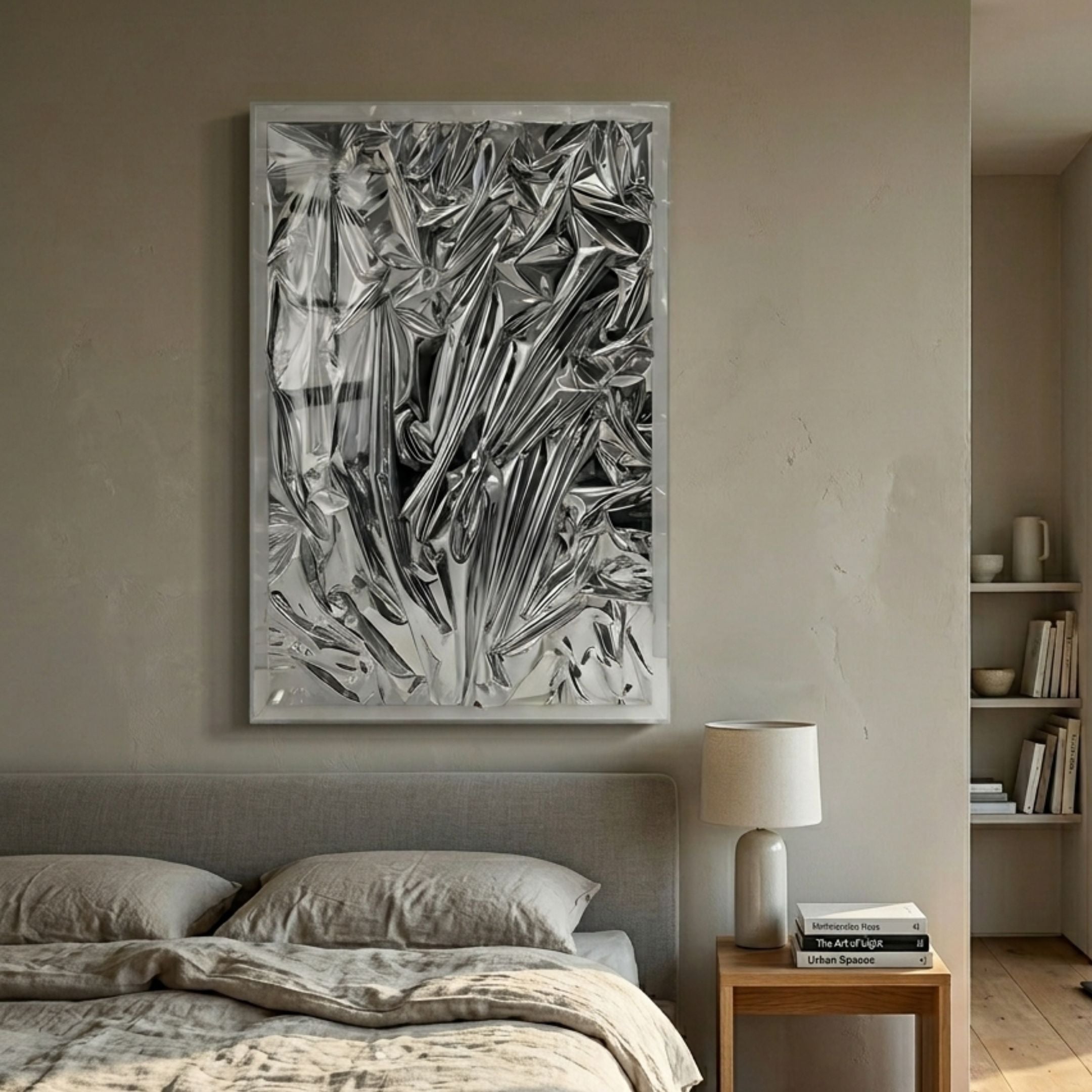 Metallique Silver Crinkle Texture Leather 3D Wall Art in clear acrylic frame, mounted above a linen-dressed bed with bedside lamp and books.