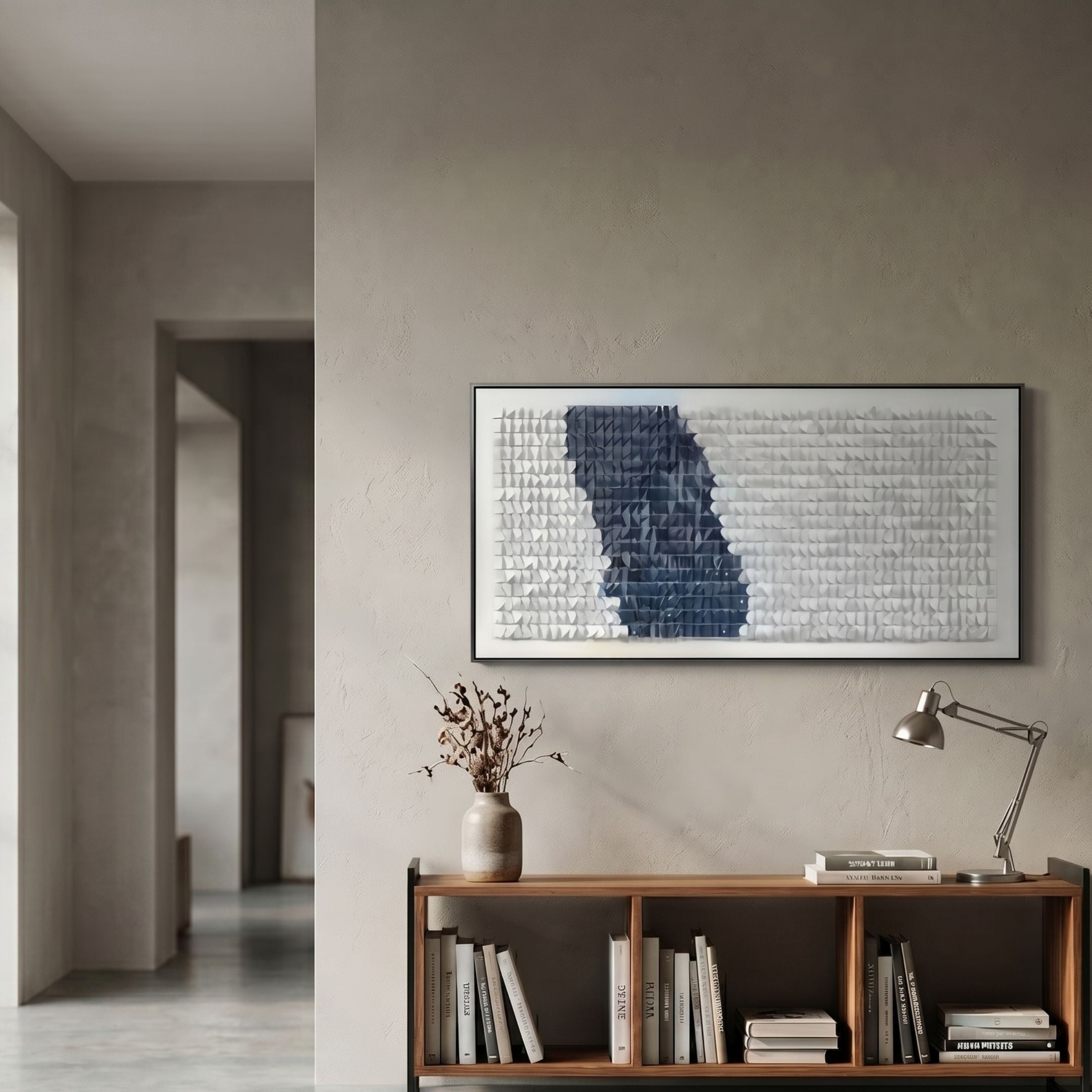Fractura Deep Indigo Wide 3D Acrylic Wall Art by Giant Sculptures displayed above a wooden console with books, vase, and lamp in a modern hallway.