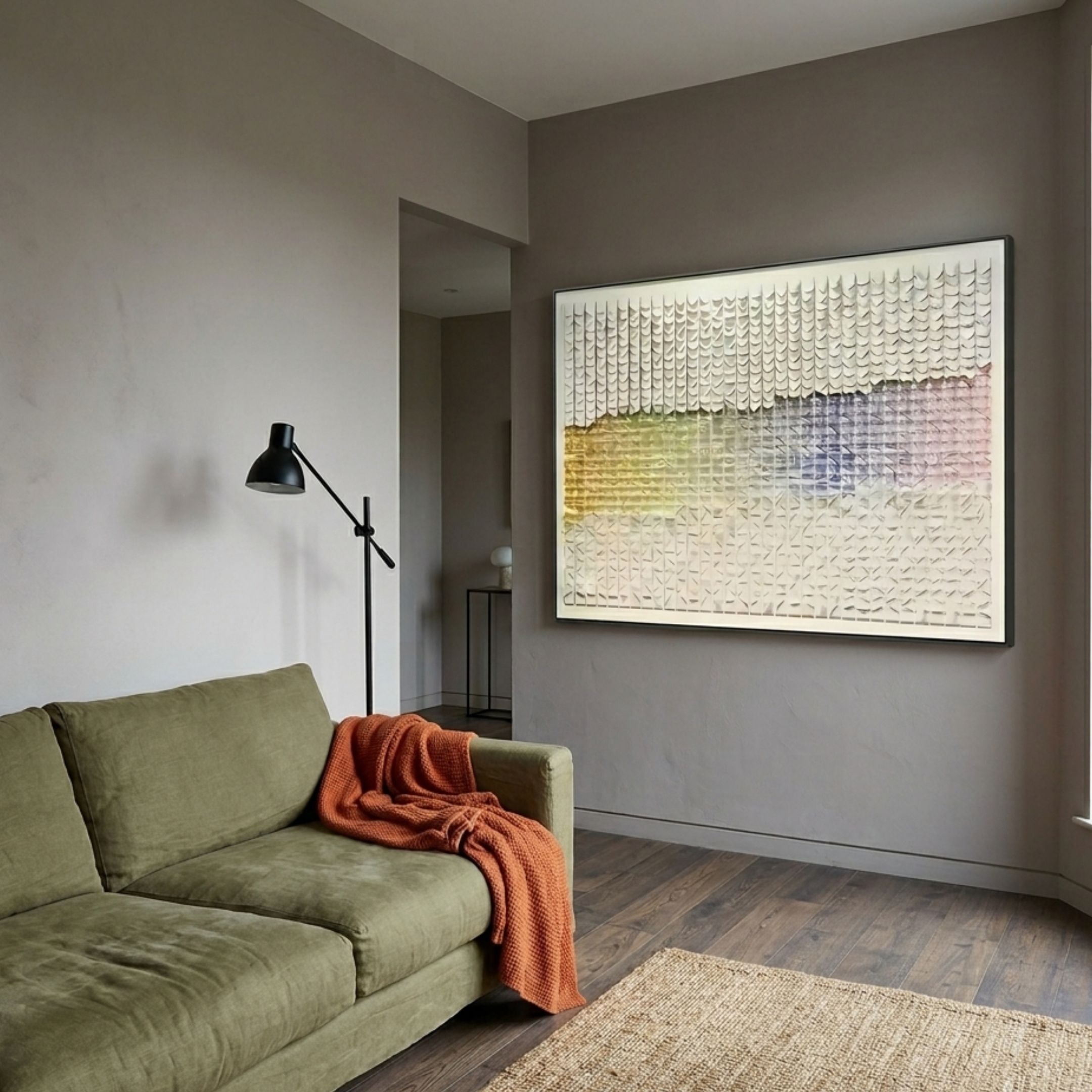 Wave II Pastel Gradient 3D Acrylic Wall Art by Giant Sculptures displayed above an olive green sofa with a rust throw in a warm grey living room.