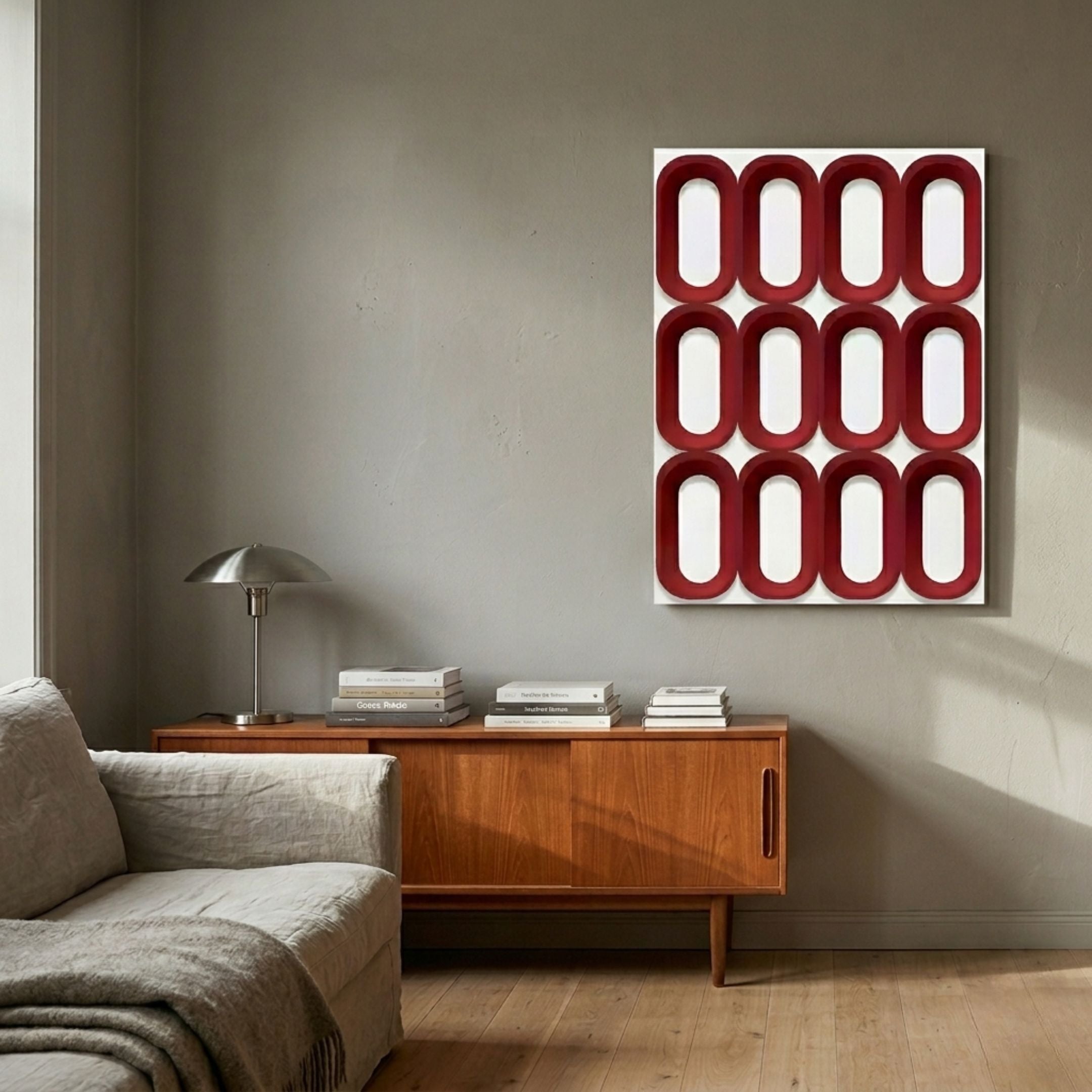 Revela White & Red Geometric Wood Relief 3D Wall Art with twelve raised red ovals on a white panel, displayed above a teak sideboard in a living room.
