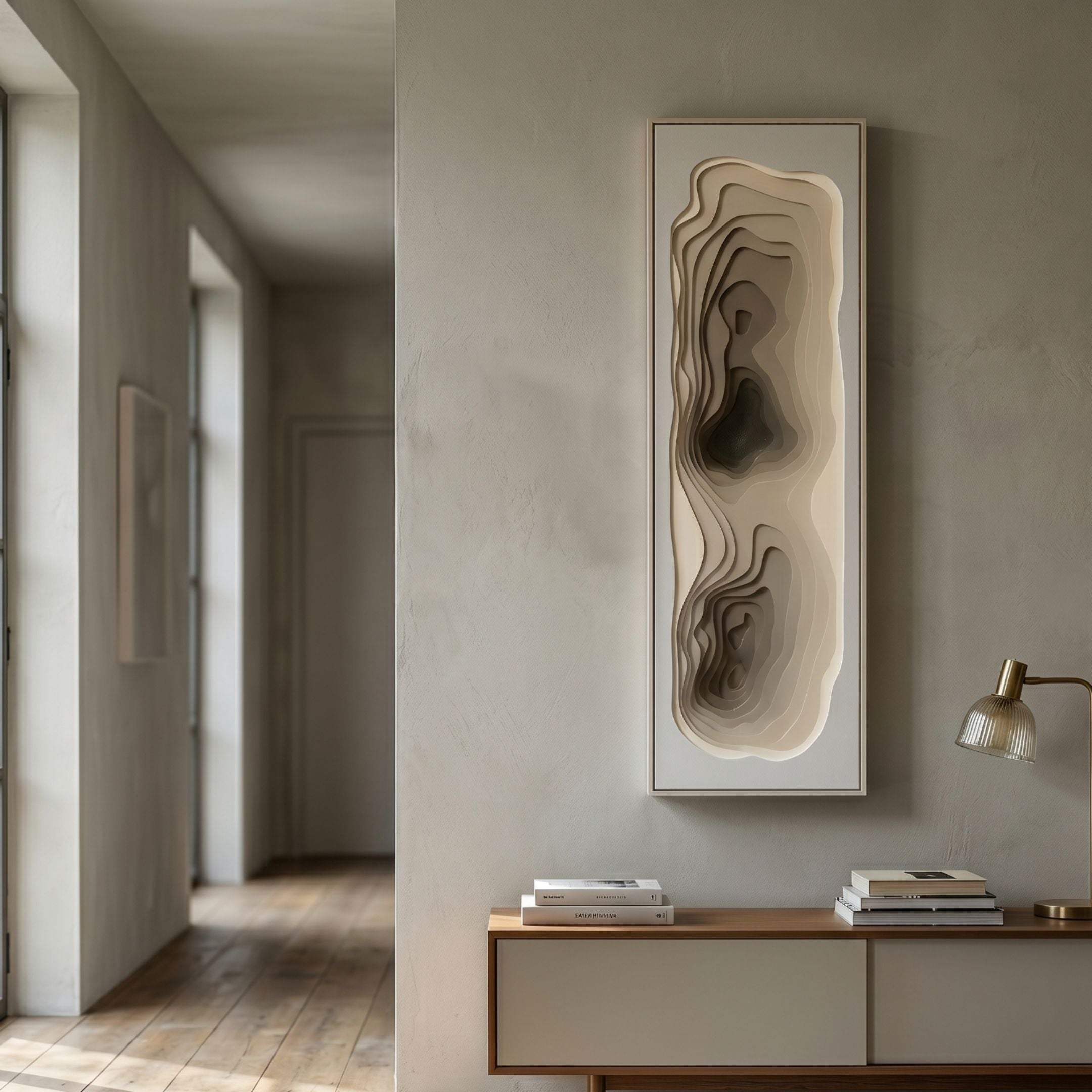 Bathys Beige Gradient Carved 3D Wall Art by Giant Sculptures, a tall vertical panel of layered topographic contours, displayed in a neutral hallway above a console.