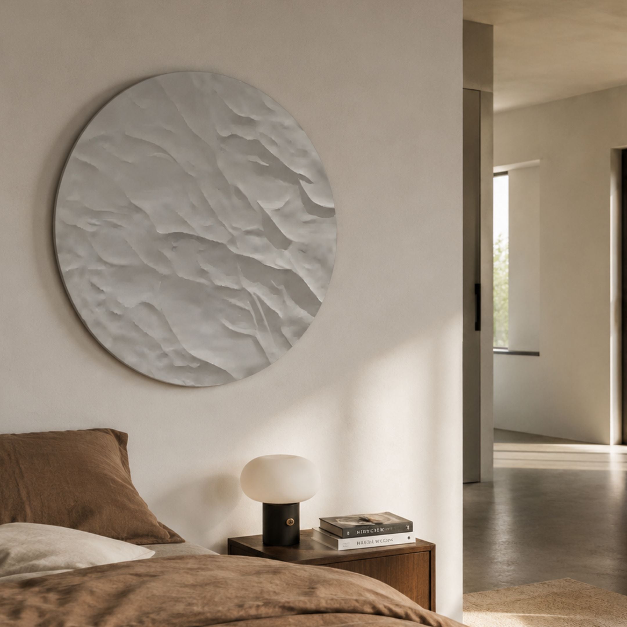 Orenda Subtle Wave White Wood Relief 3D Wall Art mounted above a wooden bedside table with a lamp and books, beside a bed with brown linens.