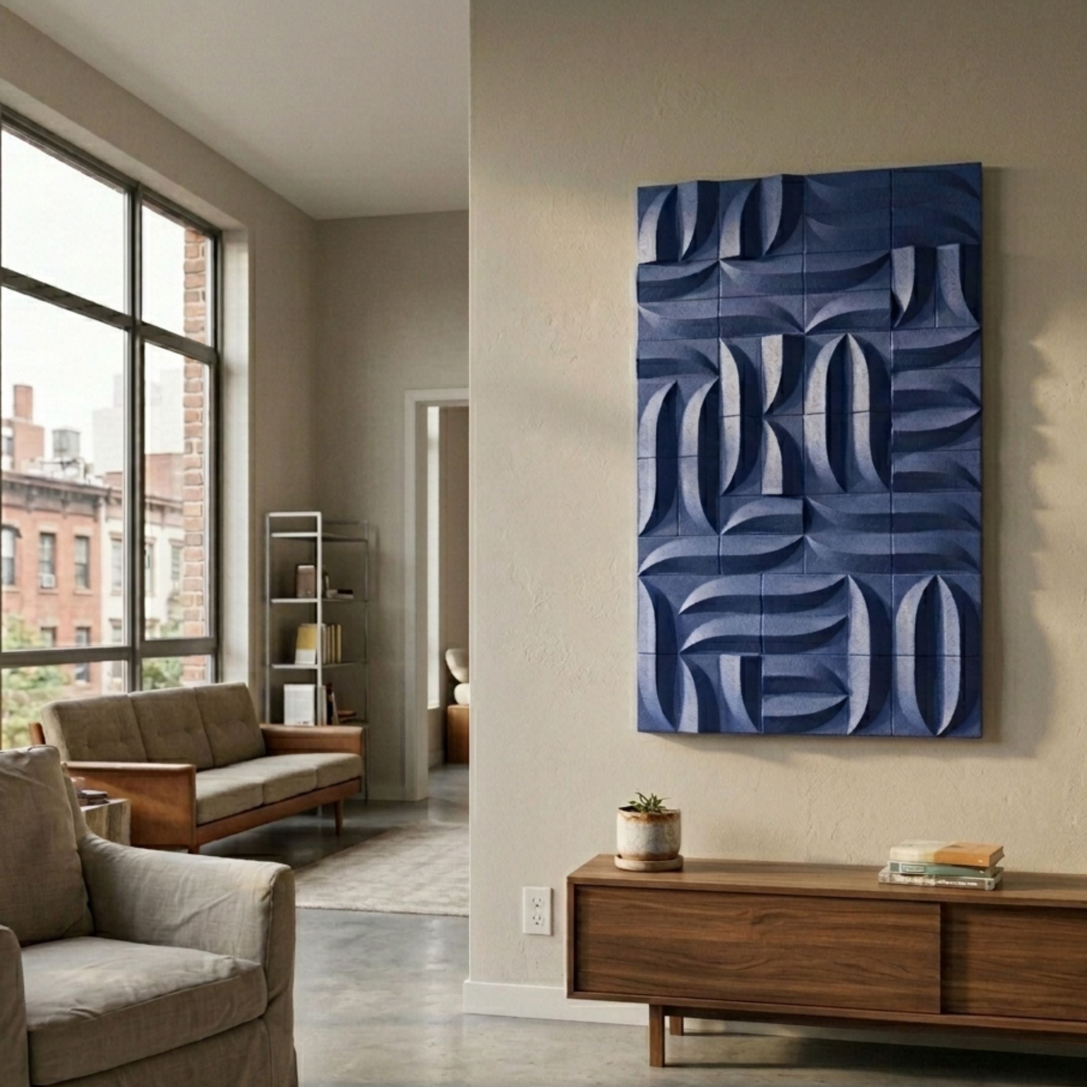 Ombra Blue Hand-Painted 3D Wood Relief Wall Art by Giant Sculptures, displayed on a beige wall above a walnut sideboard in a sunlit modern living room.
