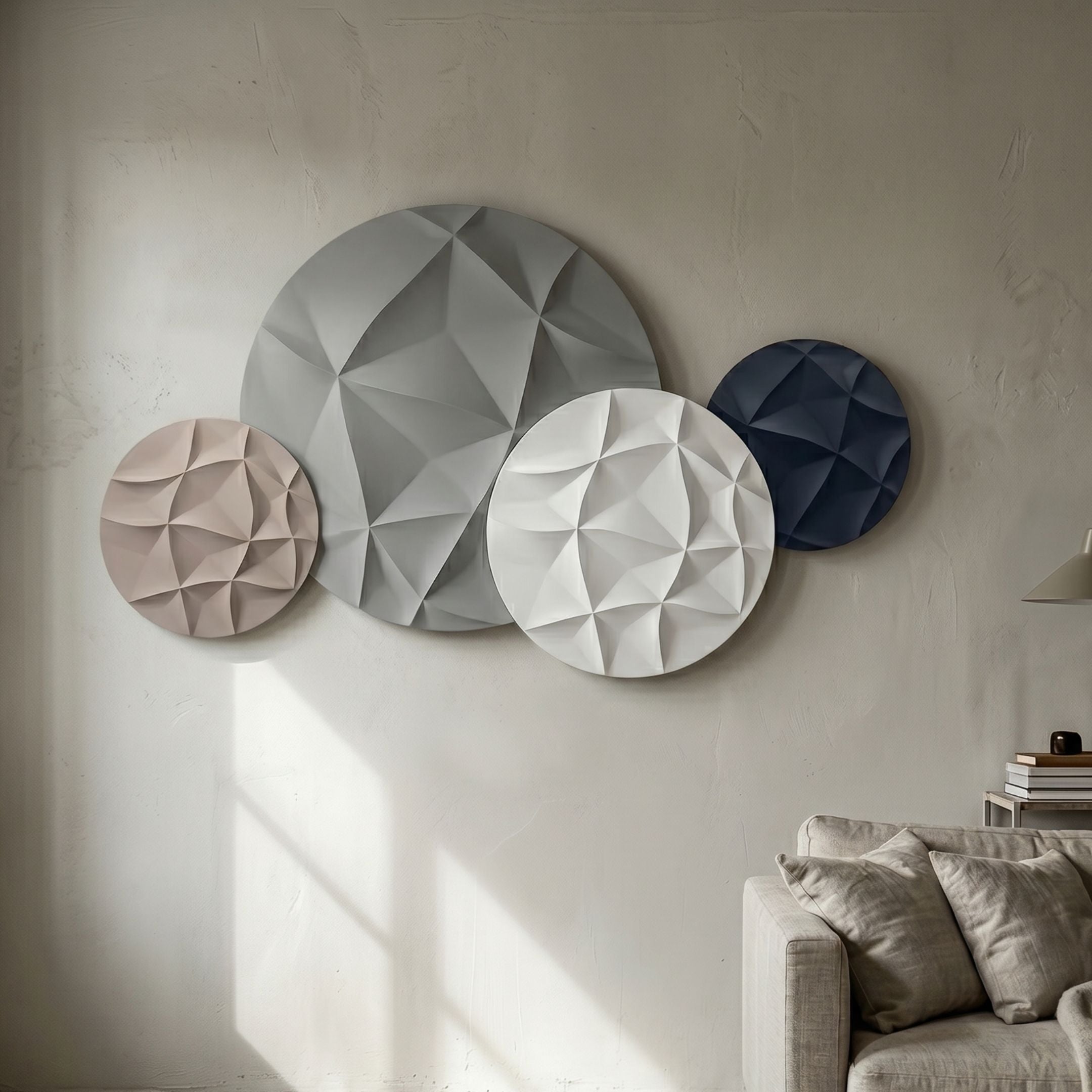Orbita 4-Set Circular Monochrome 3D Wood Relief Wall Art by Giant Sculptures in grey, white, beige and navy, mounted above a linen sofa on a cream wall.