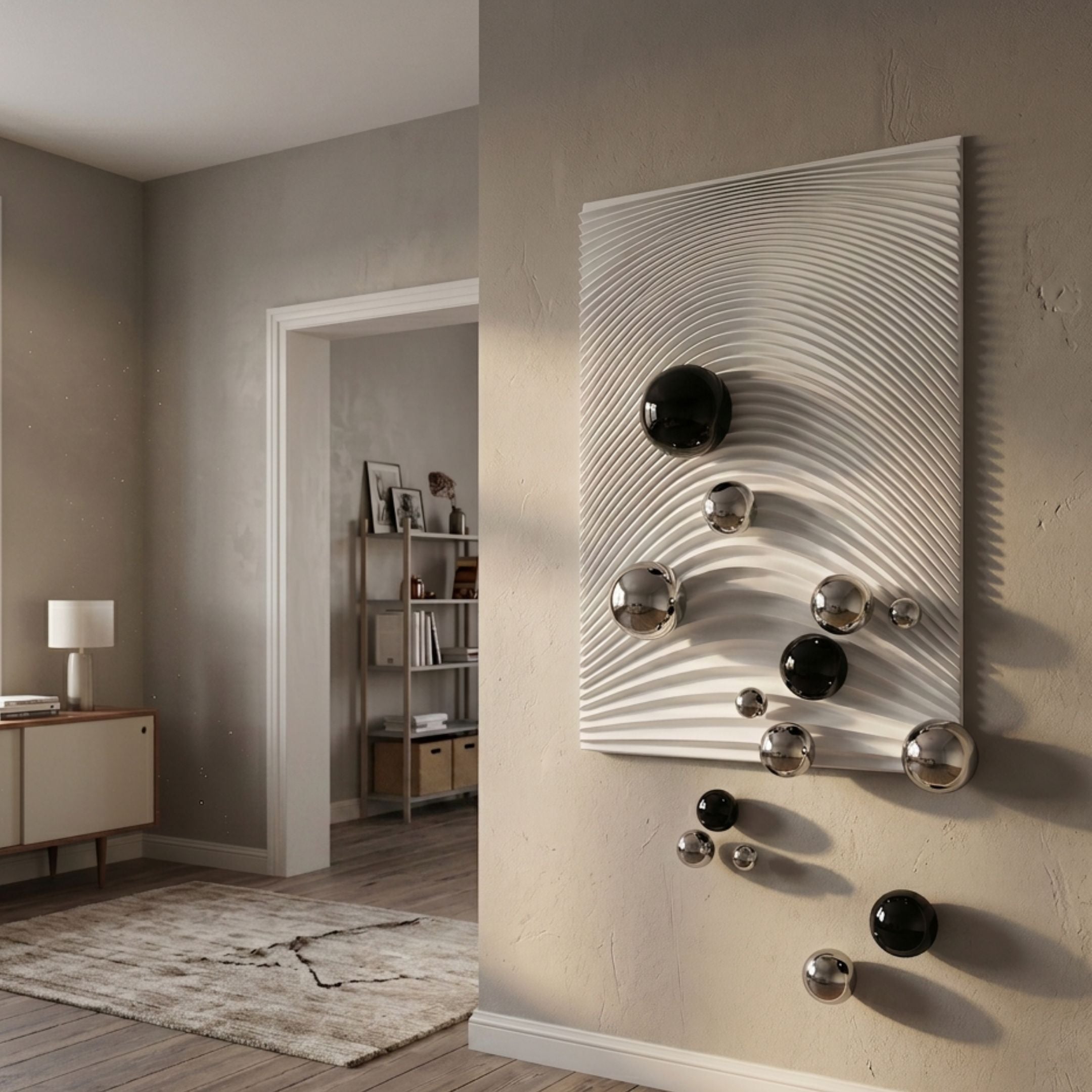 Sphera White 3D Wood Relief Wall Art by Giant Sculptures mounted in a neutral hallway, concentric ripples with black and silver metal spheres cascading down.