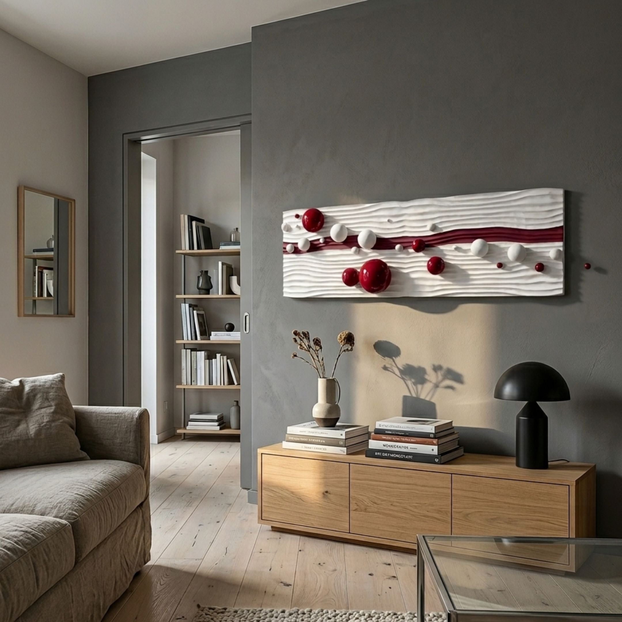 Lustra Red & White 3D Wood Relief Wall Art with metal balls by Giant Sculptures mounted above an oak sideboard in a grey-walled modern living room.