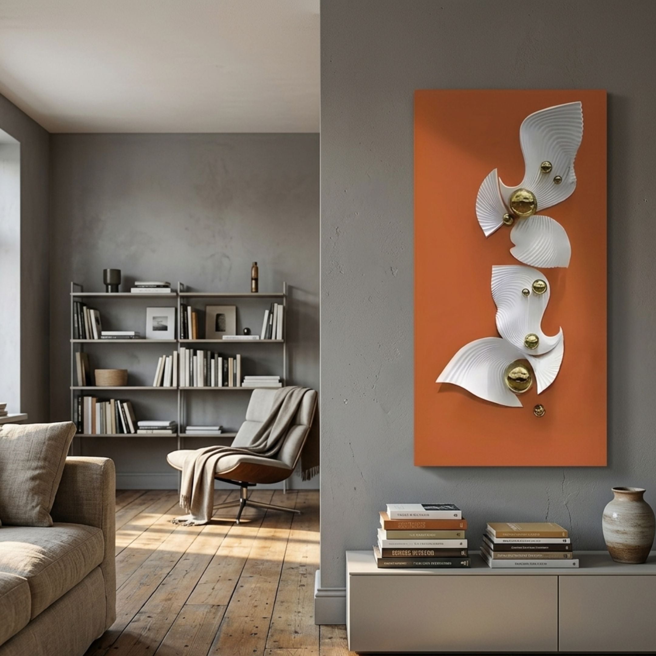 Aurelia Orange & White 3D Wood Wall Art With Metal Ball by Giant Sculptures displayed on a grey wall in a modern living room with bookshelf and armchair.