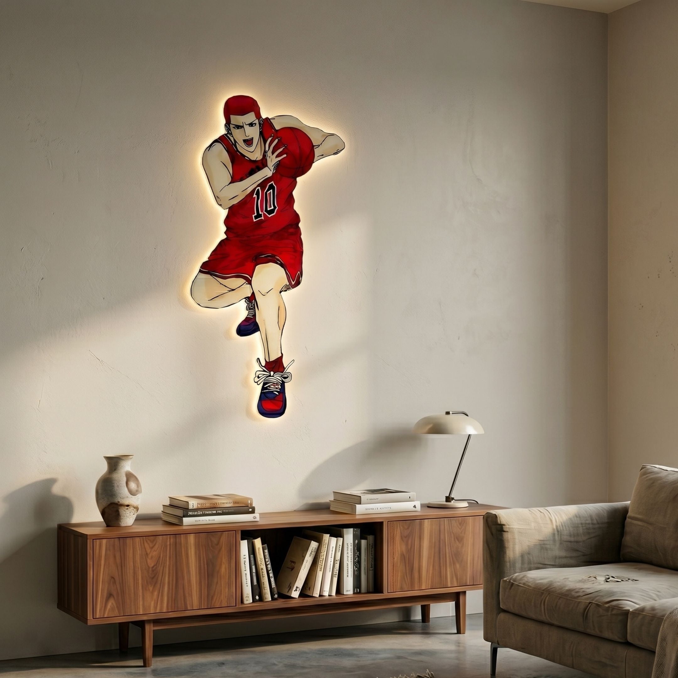 Enlustra III Game On UV Wood LED Wall Art by Giant Sculptures showing an anime basketball player in red #10 jersey, mounted above a walnut console with books and lamp.
