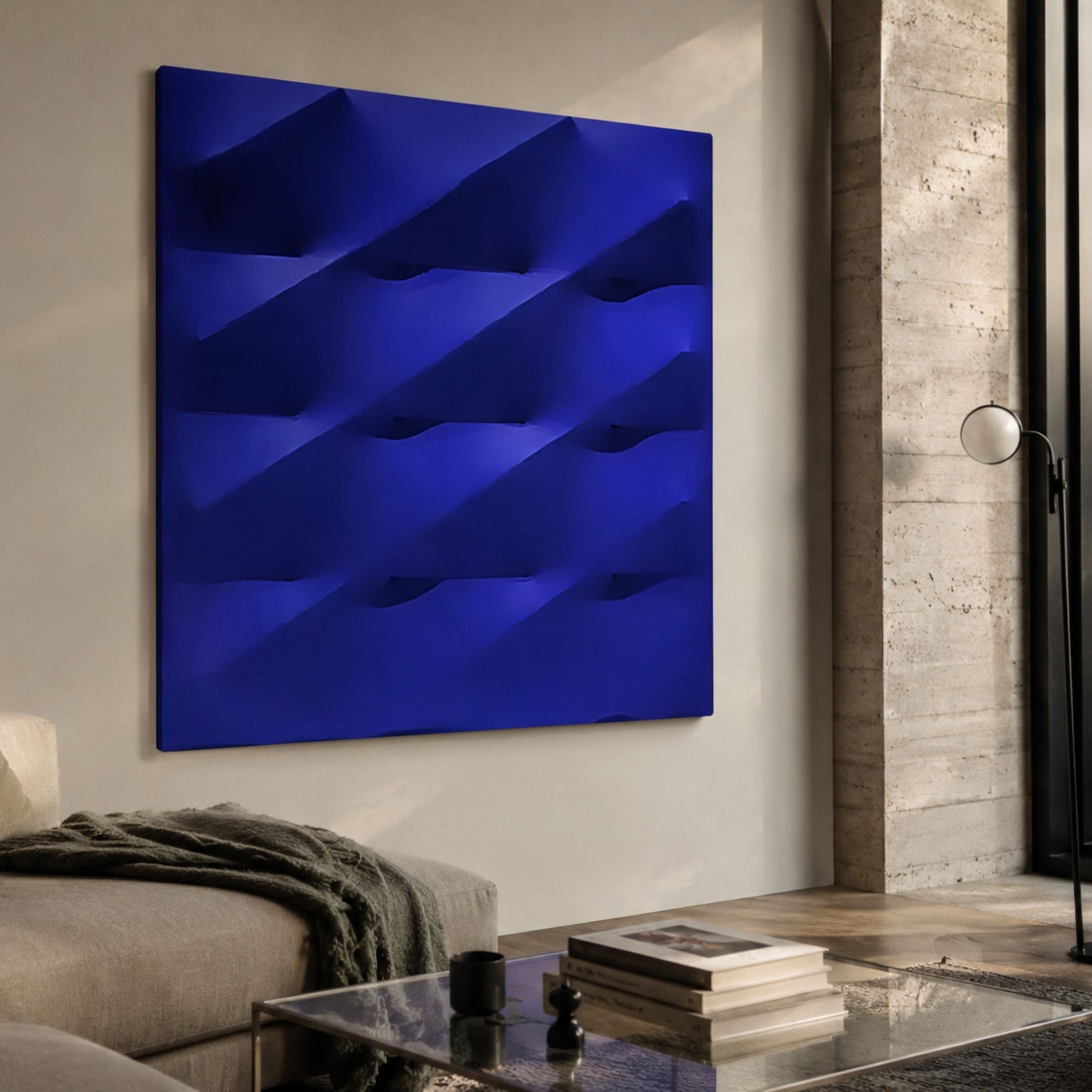 Verto Deep Blue Stretch Fabric Layered Wooden 3D Wall Art with diagonal ridges, mounted in a modern living room above a sofa beside a travertine column.