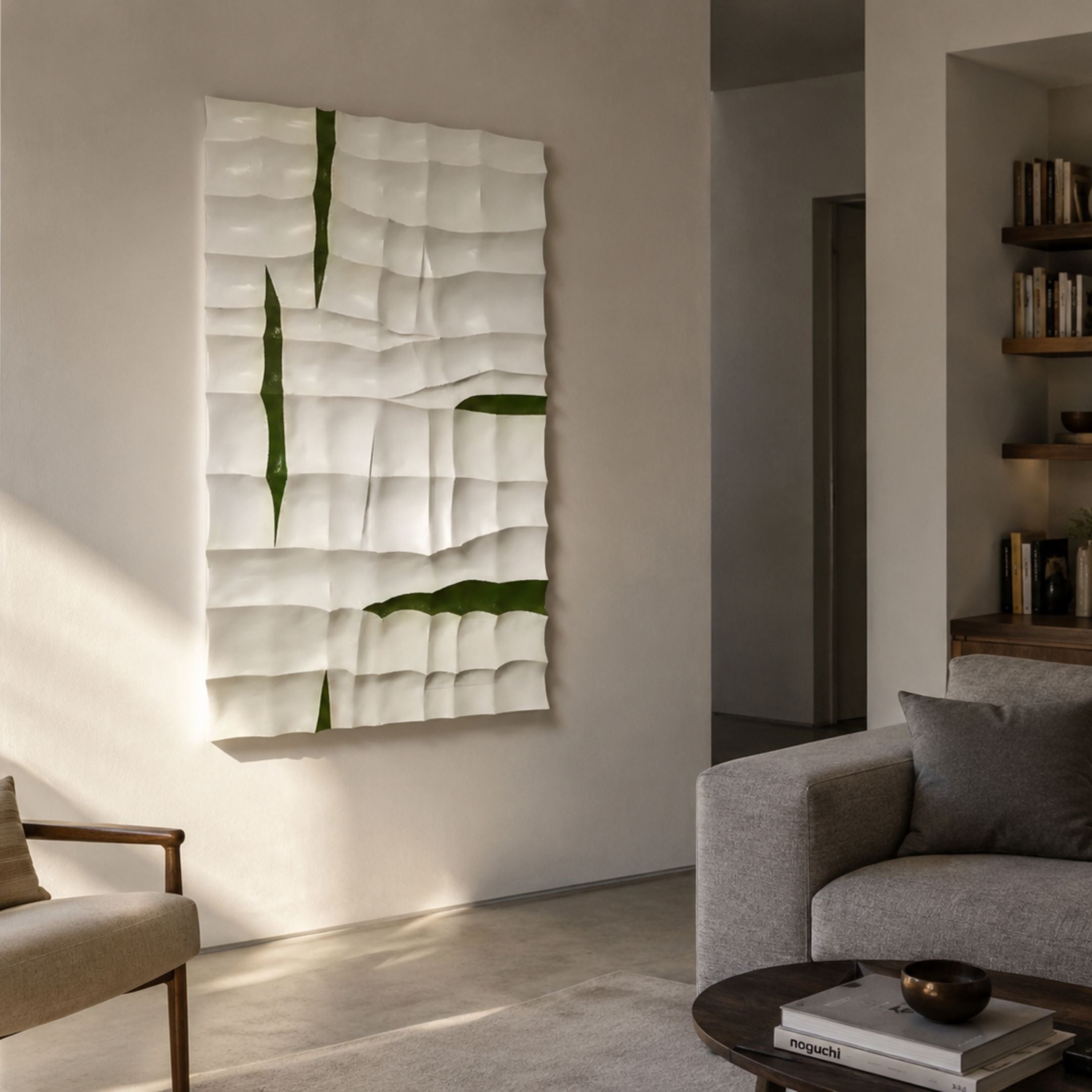 Striata White & Green Wood Carving 3D Wall Art by Giant Sculptures, mounted in a sunlit modern living room beside a grey sofa and wooden armchair.