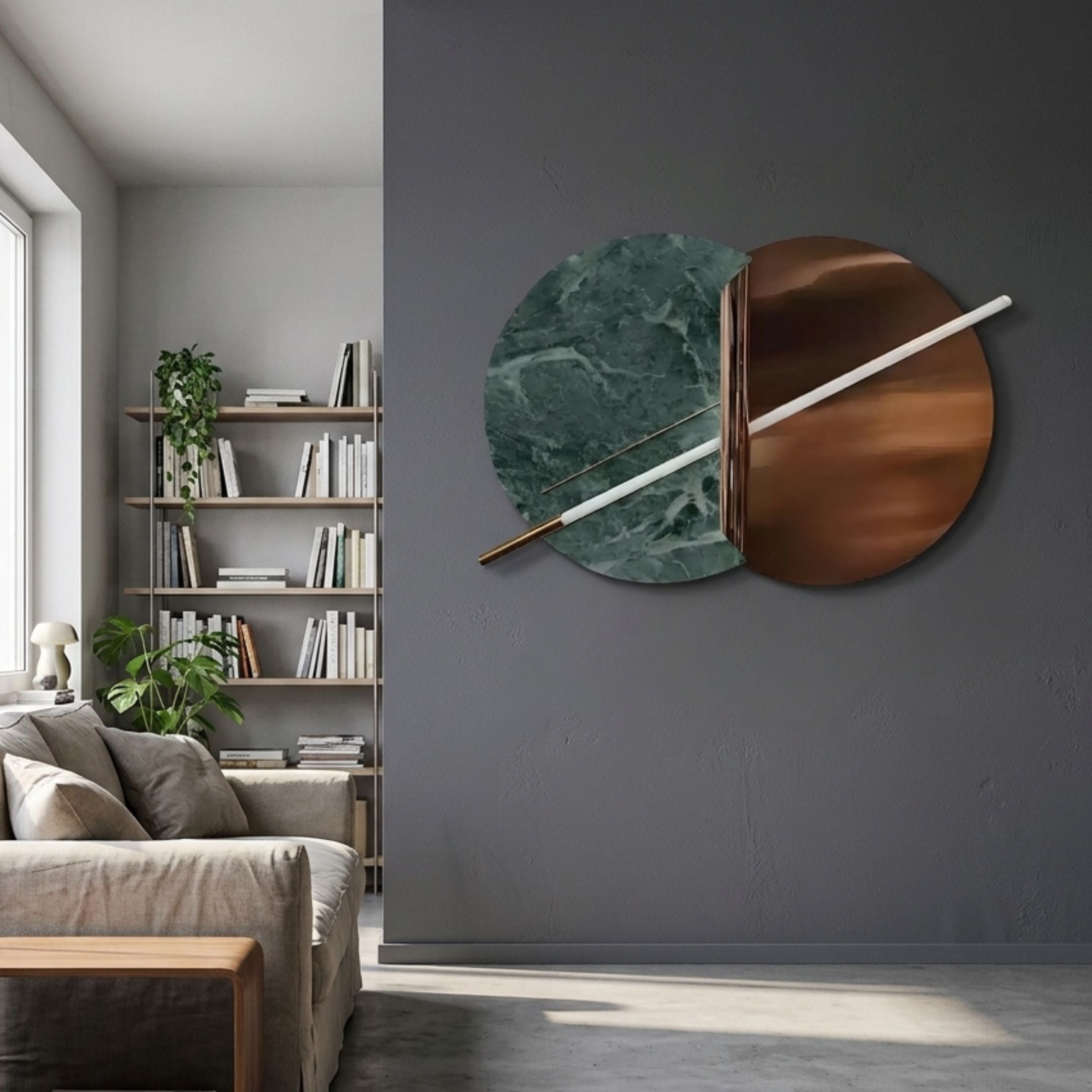 Lunaris Green Marble & Bronze LED Wall Art by Giant Sculptures mounted on a dark grey wall beside a living room bookshelf, sofa, and houseplants.