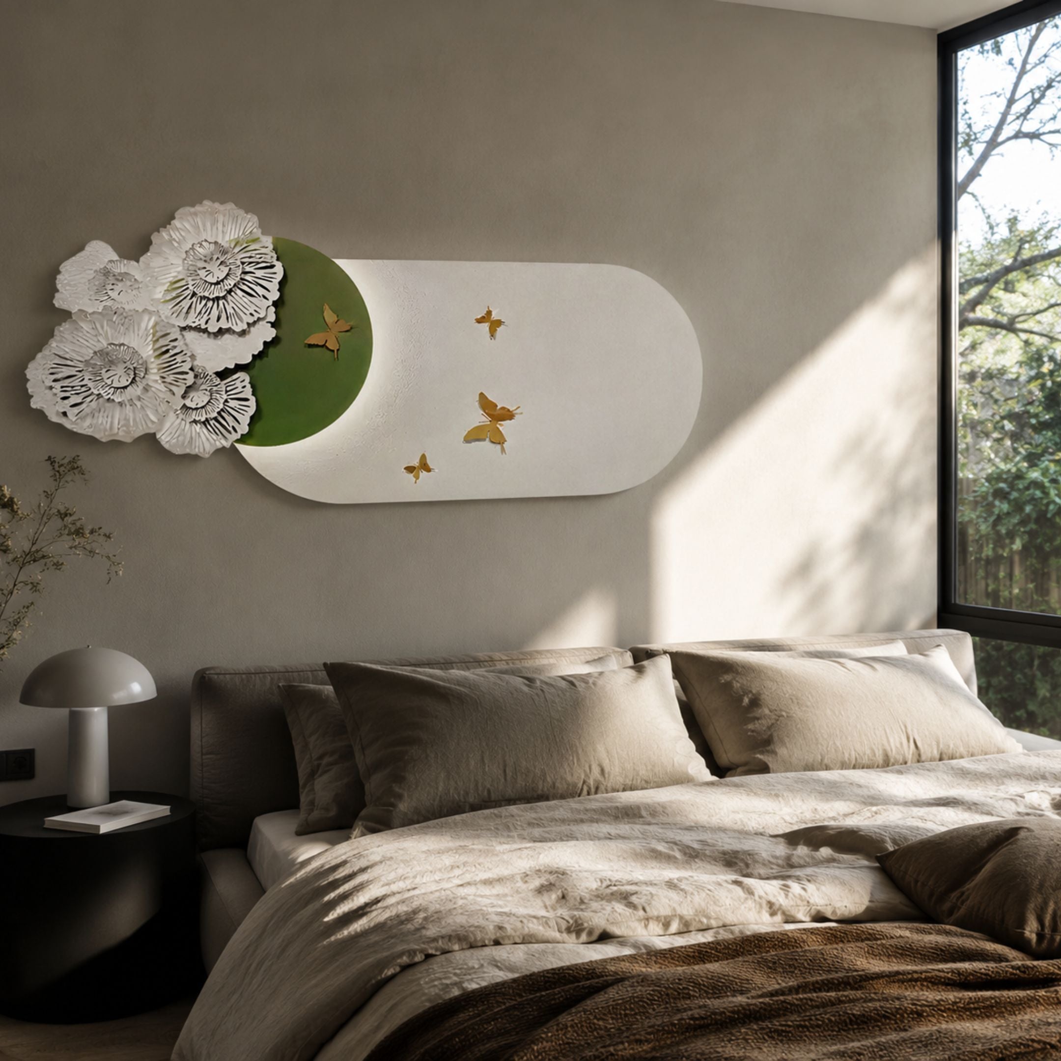 Flutter Bloom Green Butterfly Floral 3D Wall Art by Giant Sculptures mounted above a linen-dressed bed, with sculpted white blooms and gold butterflies on a green oval.