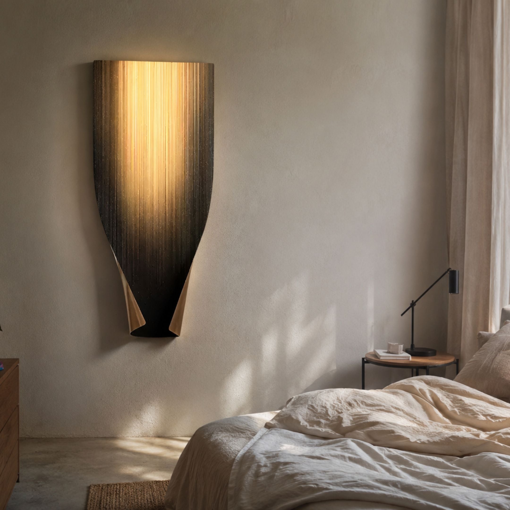 Celestial Midnight Gradient Curved Vertical Abstract Metal Wall Art by Giant Sculptures mounted above a bed, glowing warmly against a soft plaster wall.