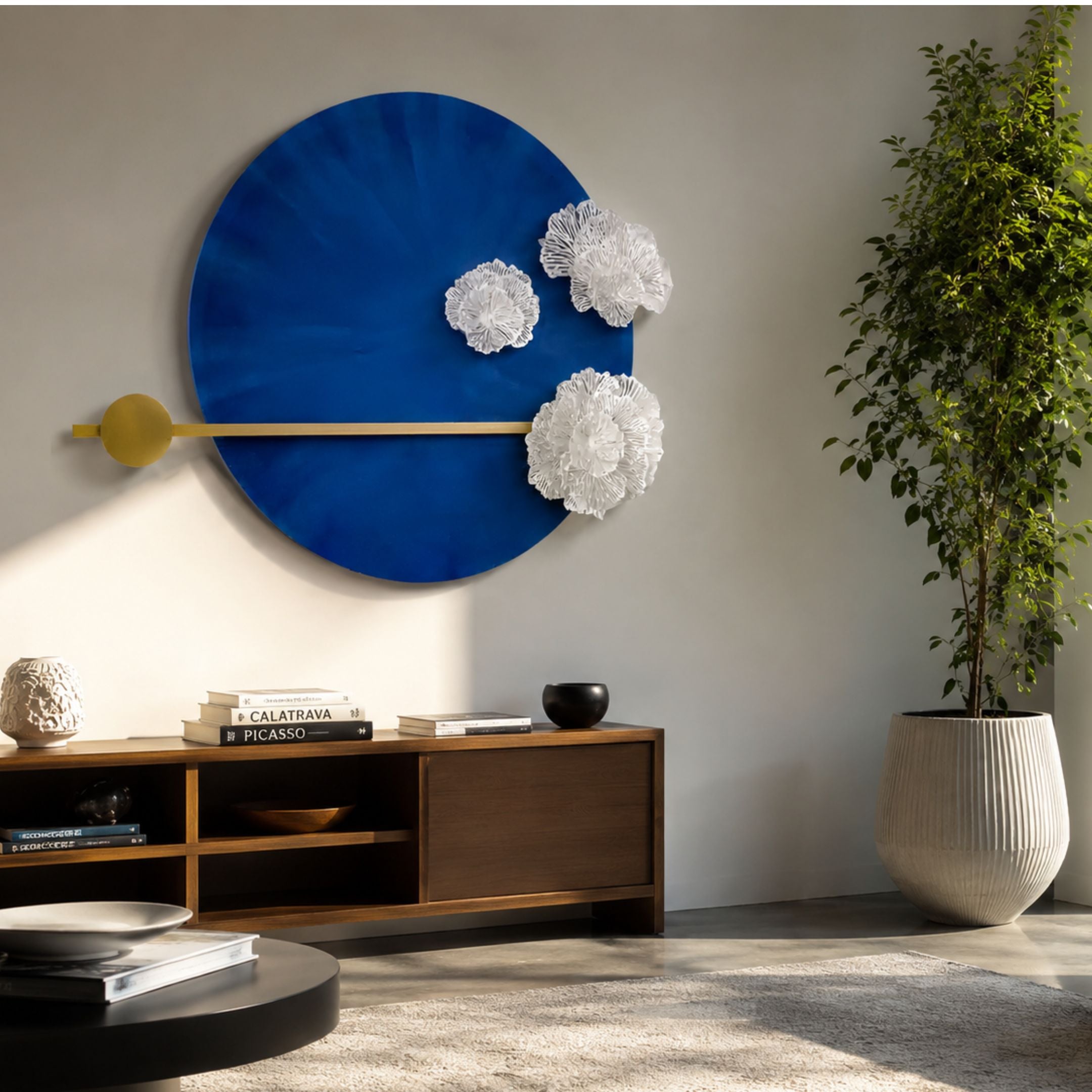 Nova Floral Radiant Sapphire Blue Circular Wall Art with white 3D florals and gold detailing, displayed above a wooden console in a modern living room.