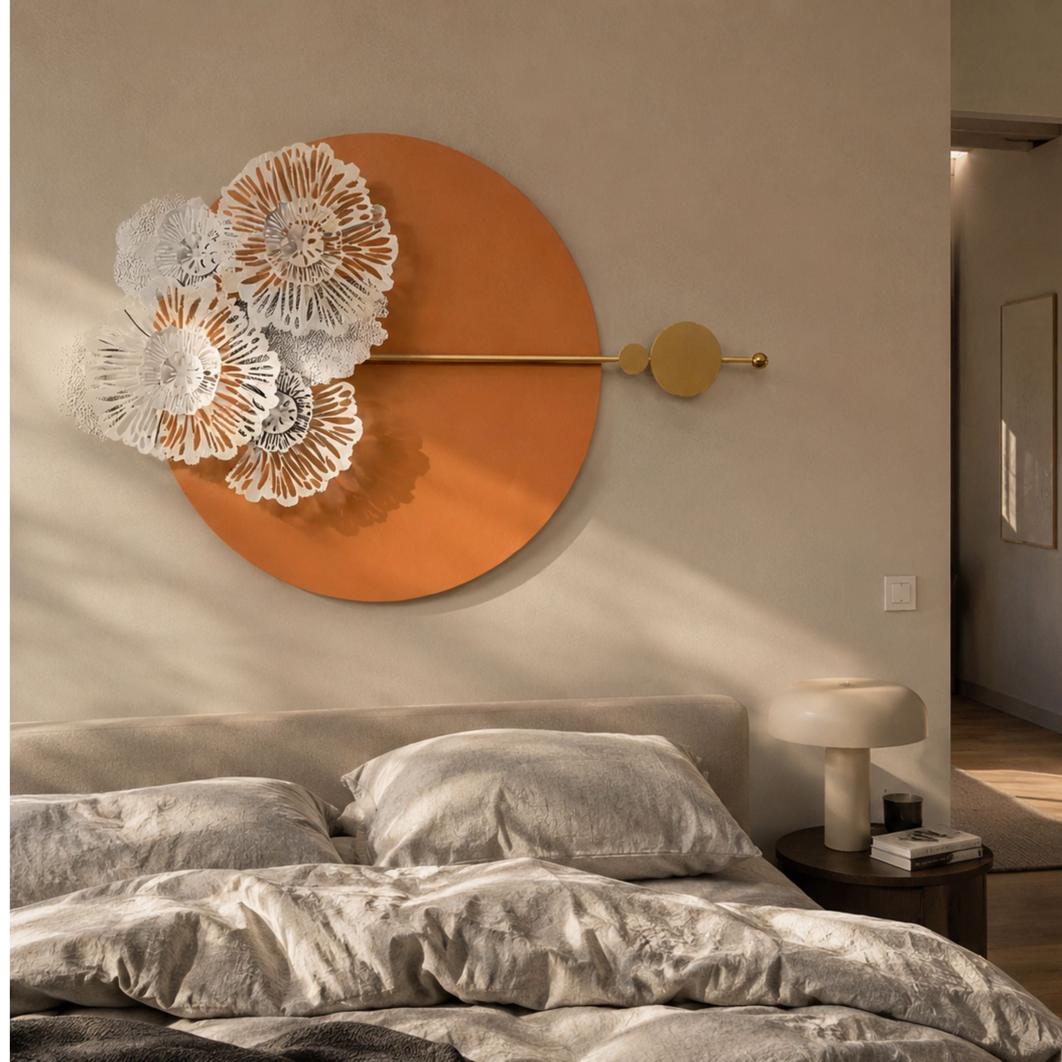 Blossom Halo Terracotta Round Floral Decorative Wall Art mounted above a bed with white and grey blooms, gold rod and circles, beside a mushroom lamp.
