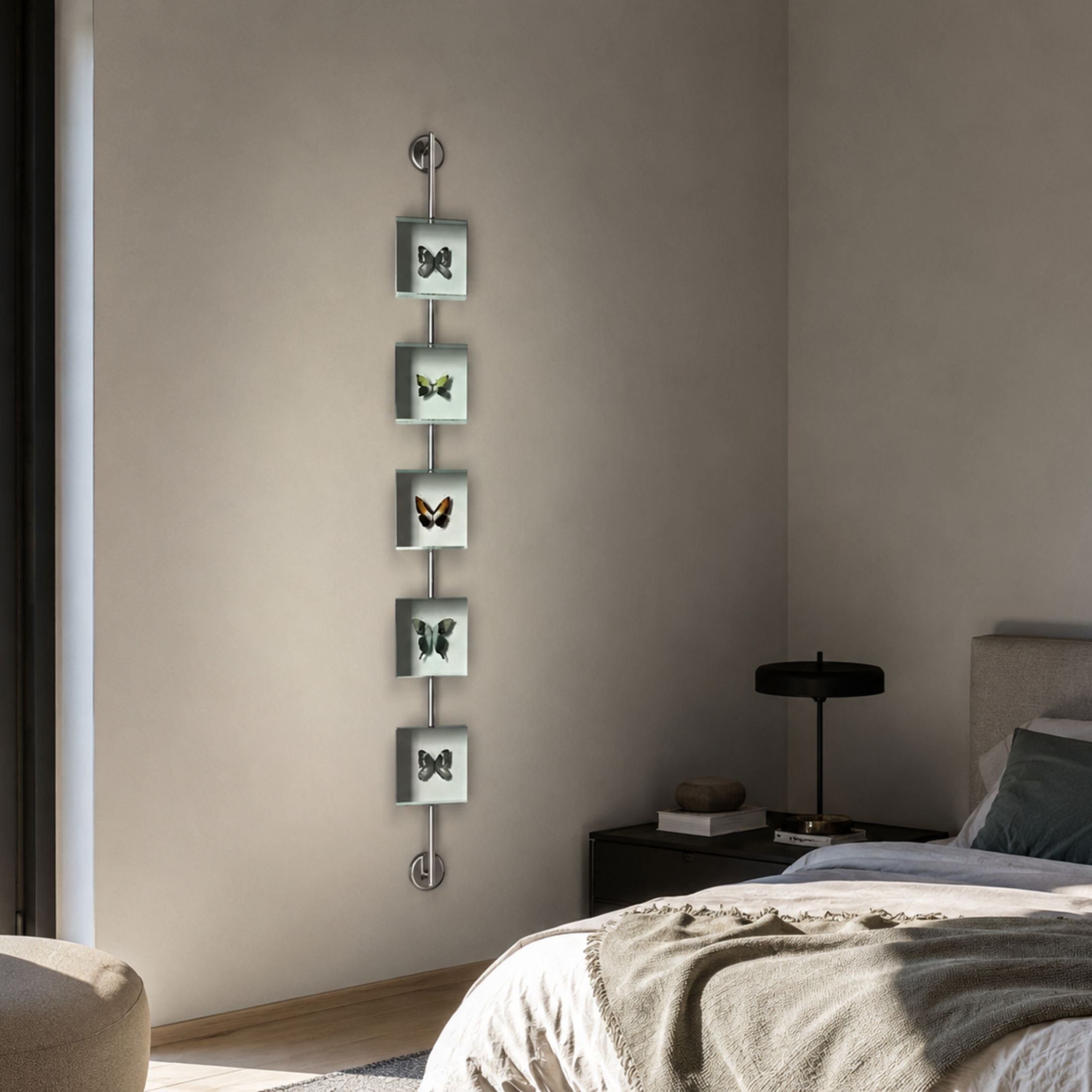 Papilio Butterfly Vertical Blue Modern 3D Wall Art by Giant Sculptures, five glass-framed butterfly specimens on an iron rod, displayed beside a bed.