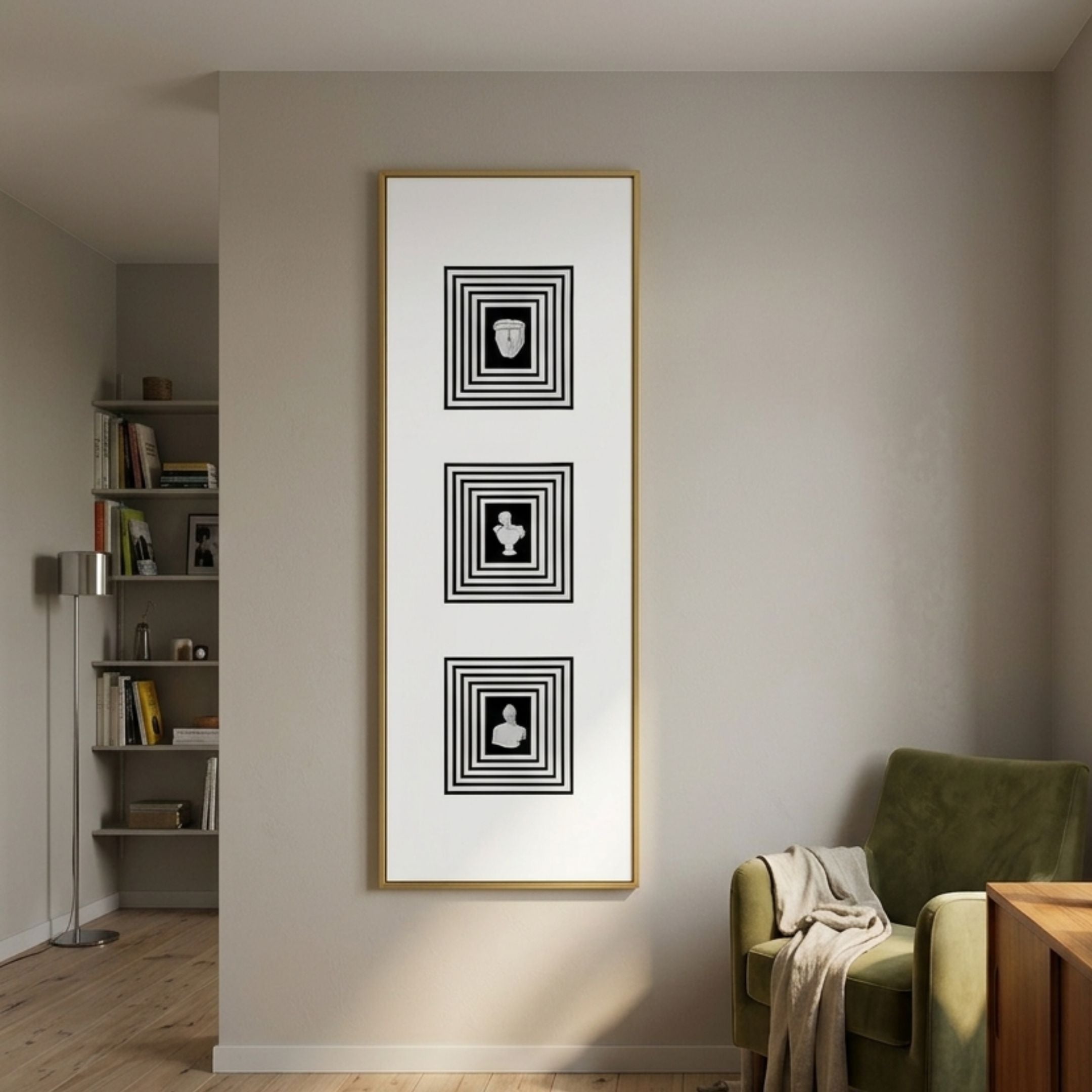 Lustre Black & White Plaster Statue Vertical Wall Art by Giant Sculptures displayed on a beige wall above a green velvet armchair beside a bookshelf.