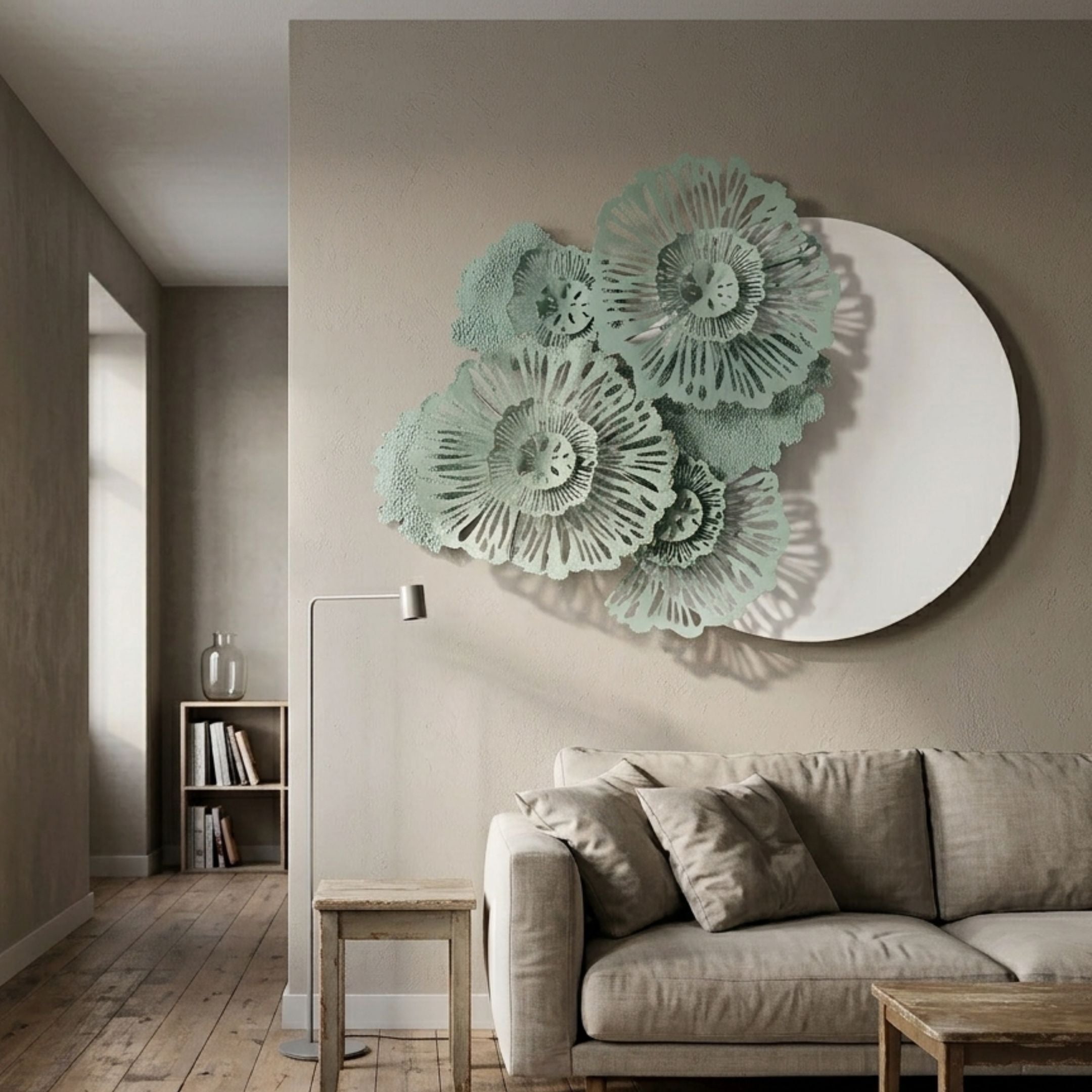 Fleur Halo White Round Green Metal Floral Decorative Wall Art mounted above a beige linen sofa in a neutral living room with floor lamp and timber flooring.