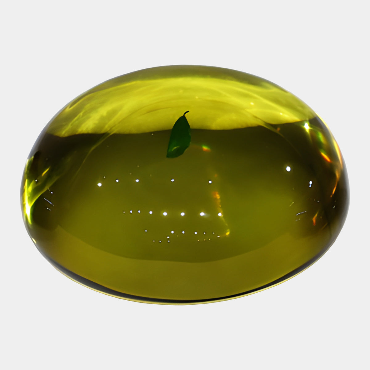Olive Embedded Leaf Dome Resin Sculpture - 25cm, a translucent olive-toned dome with a green leaf suspended at its centre, shown on a plain white background.