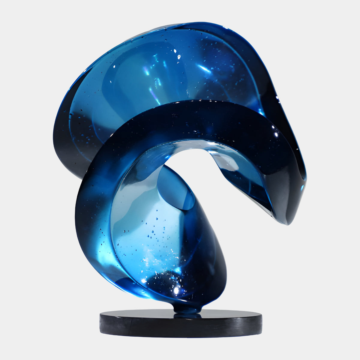 Blue Cut Sphere on a Black Disc Resin Sculpture - 23cm, swirling translucent blue resin form on a black disc base, set against a plain white background.