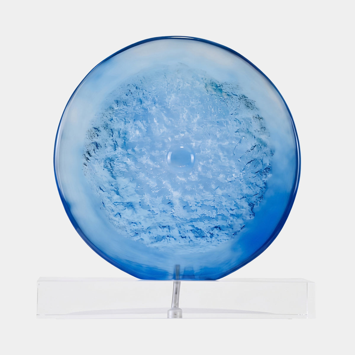 Blue Frosted Textured Disc Resin Sculpture - 47cm, round disc with frothy textured center and smooth blue rim, mounted upright on a clear block stand, plain white background.